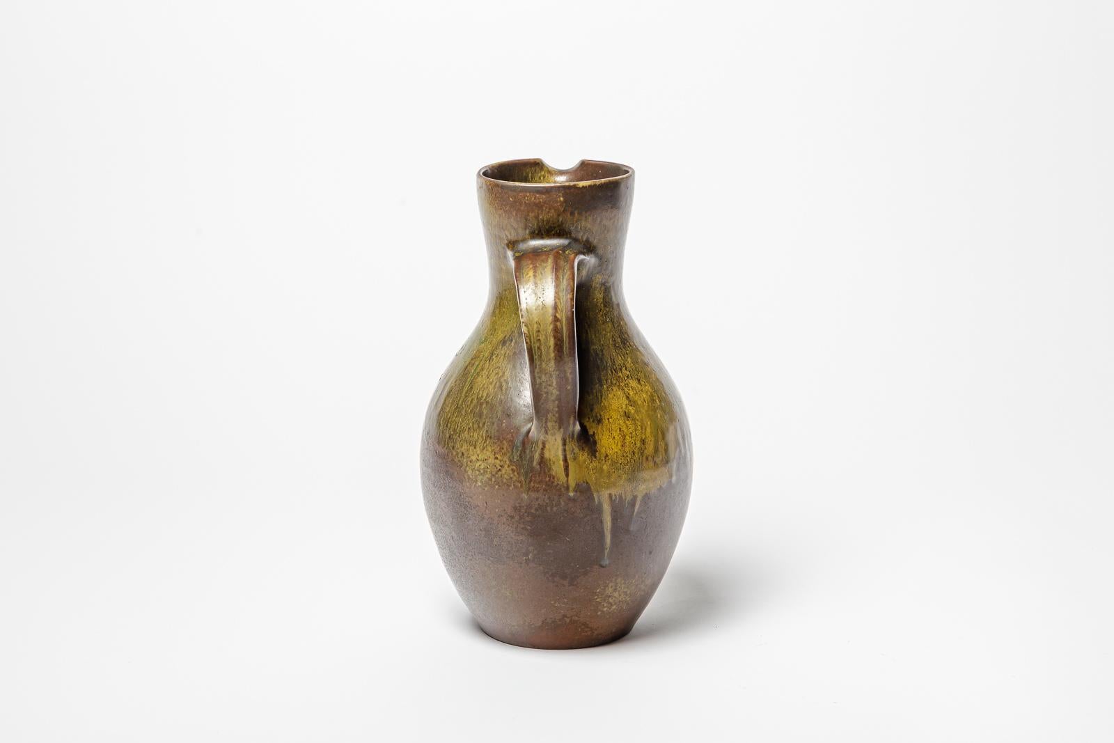 Mid-20th Century Brown and green glazed ceramic pitcher by Roger Jacques, circa 1960-1970. For Sale