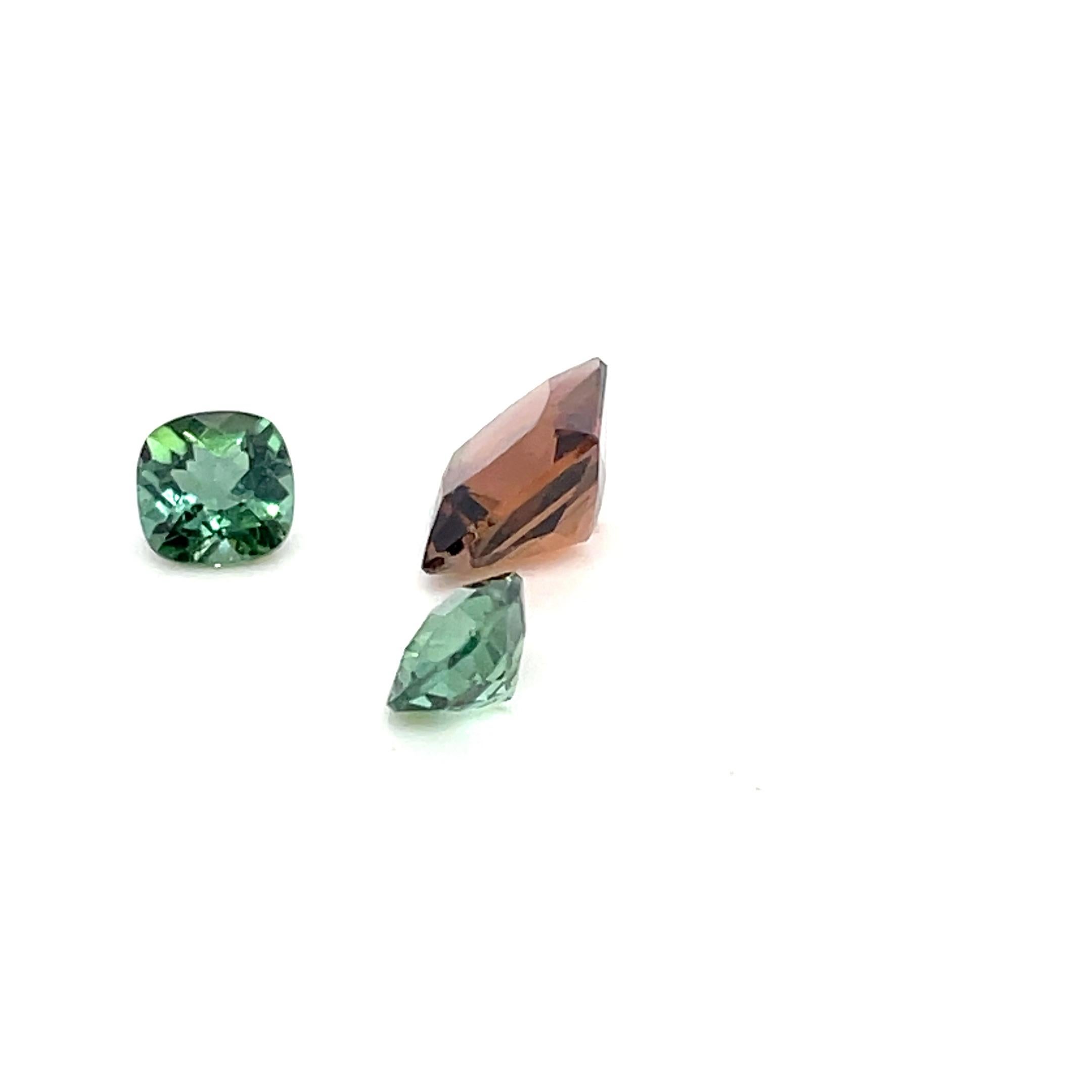 This three-piece tourmaline set (7.43 carats) showcases a stunning blend of earthy brown and vibrant green hues, sourced from Brazil. 

Known for its grounding and rejuvenating energy, brown tourmaline symbolizes stability and protection, while