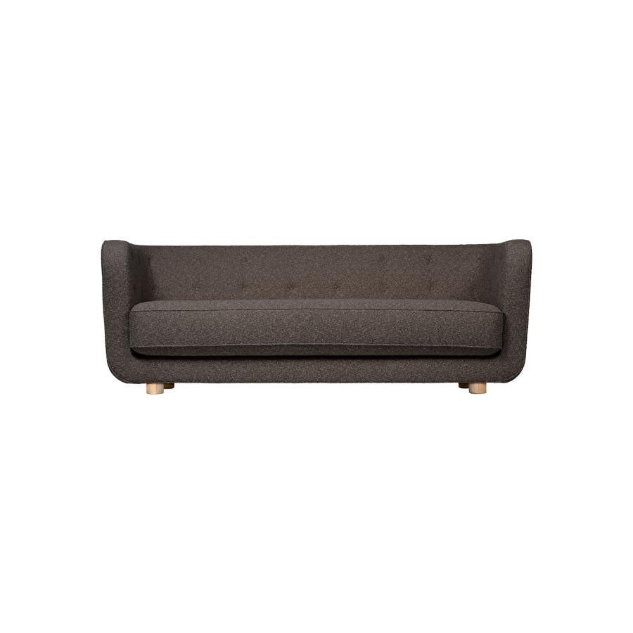 Brown and natural oak Sahco Nara Vilhelm sofa by Lassen
Dimensions: W 217 x D 88 x H 80 cm 
Materials: textile, oak.

Vilhelm is a beautiful padded three-seater sofa designed by Flemming Lassen in 1935. A sofa must be able to function in several