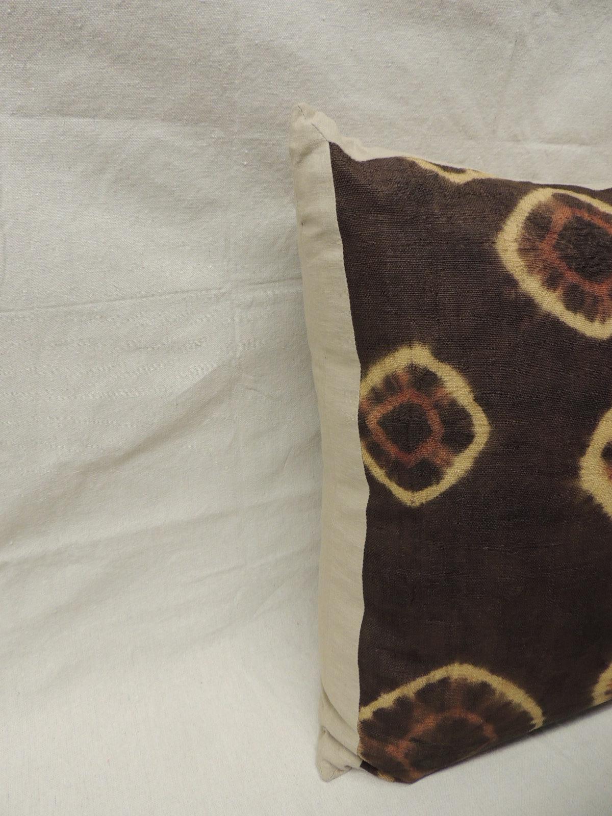Brown and orange vintage resist dye African decorative pillow.
Raffia pillows in brown with orange accents, framed and backed with vintage mocha soft color linen.
Decorative pillow handcrafted and designed in the USA. Closure by stitch (no zipper