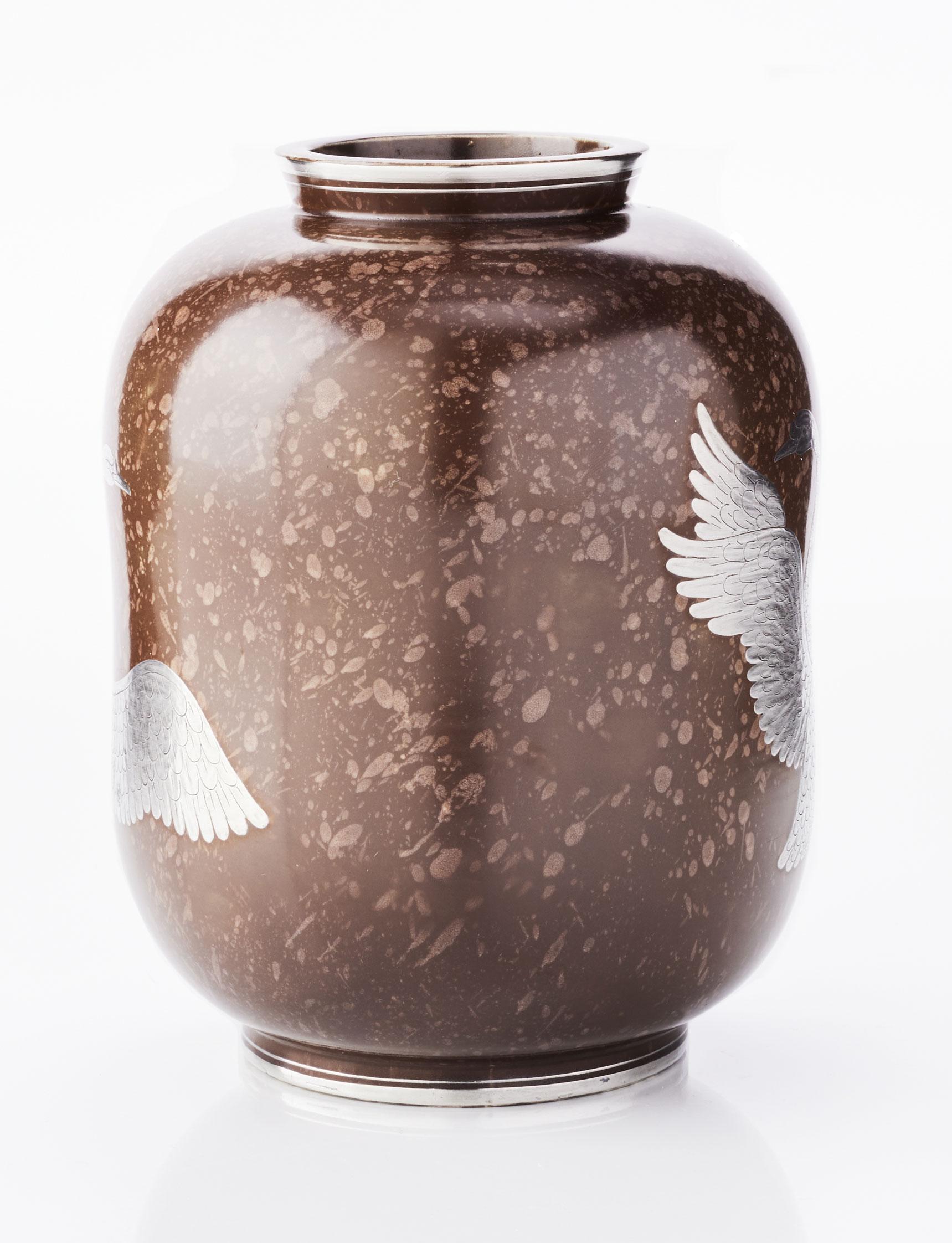 A rare and early example from Wilhelm Kåge’s iconic Argenta series, produced at the Gustavsberg porcelain factory in 1938. Crafted in stoneware with an unusual mottled brown glaze — a notable departure from the more commonly seen emerald green