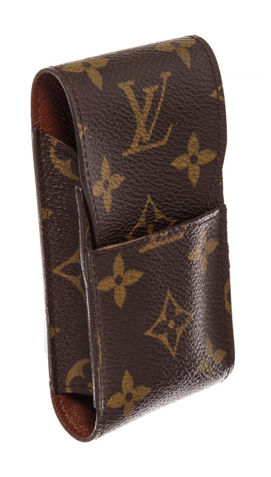 Brown and tan monogram coated canvas Louis Vuitton cigarette holder with leather lining and tab insert flap closure at front.
 


50888MSC

2.6