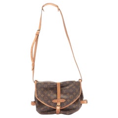 Brown and tan monogram coated canvas Louis Vuitton Saumur 30 with gold-tone 