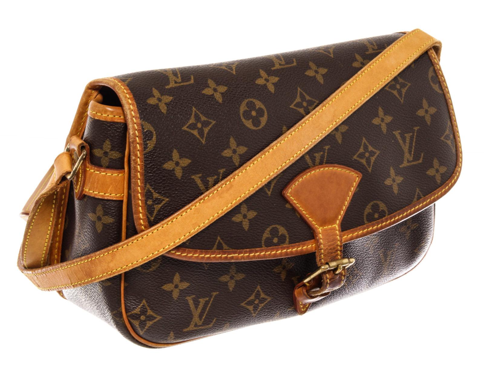Brown and tan monogram coated canvas Louis Vuitton Sologne bag with brass hardware, tan vachetta leather trim, adjustable flat shoulder strap featuring shoulder pad, exterior slip pocket at back, single pocket at flap underside, brown canvas lining,