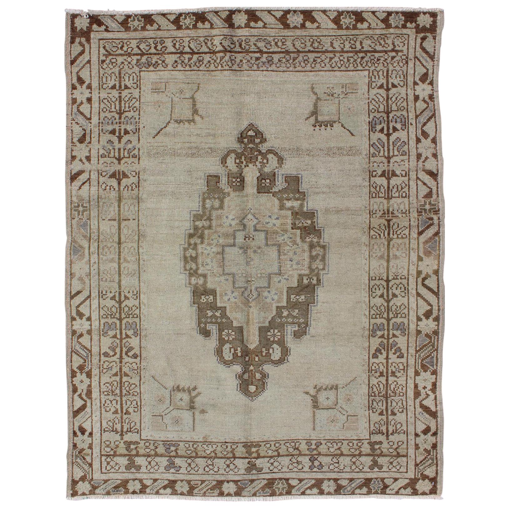 Brown and Taupe Colored Vintage Turkish Oushak Rug with Medallion Design For Sale