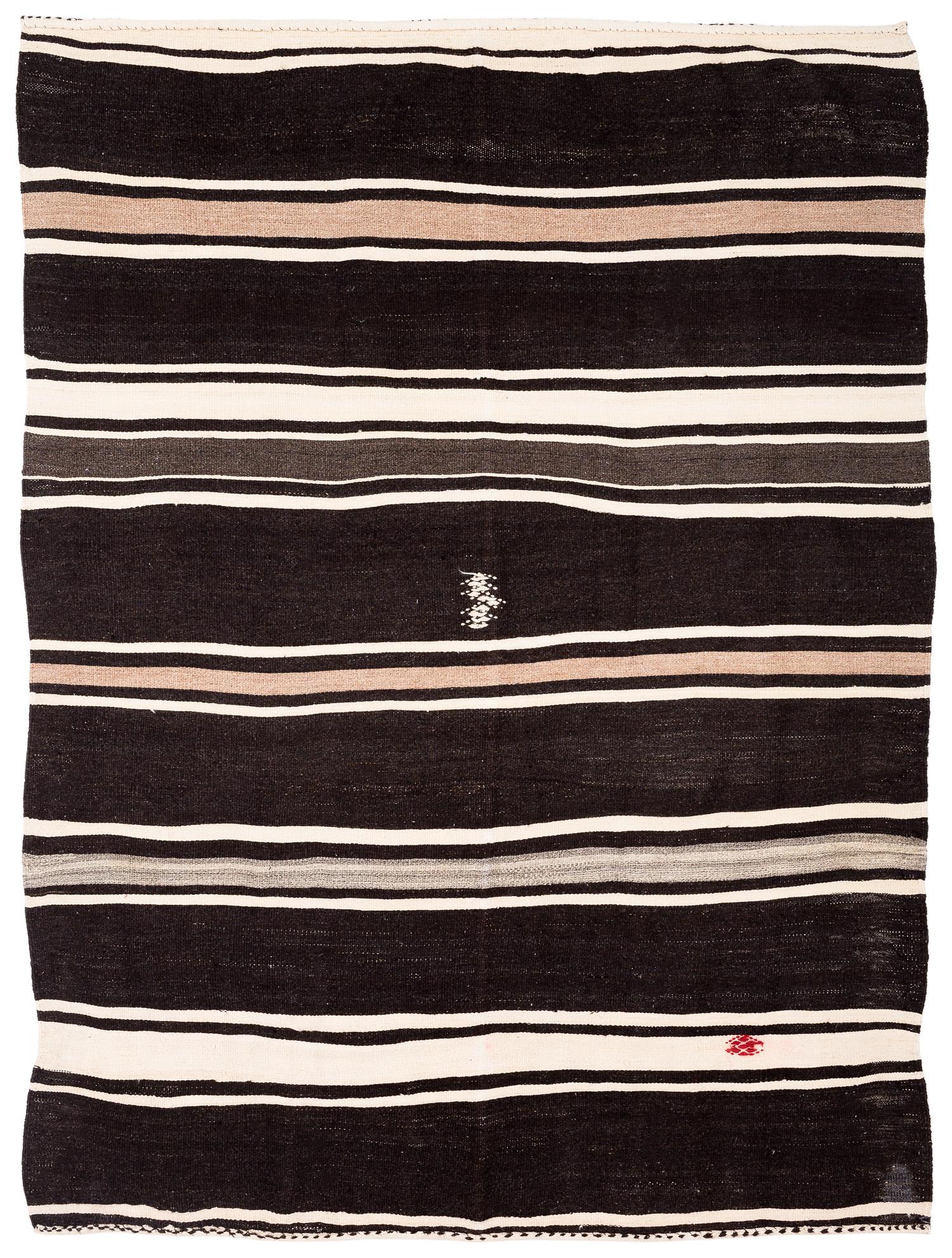 Brown and white striped kilim made of wool. This rug features a white symbol in the center and a red ornament on it. Kilims make great casual carpets because they are a thinner pile, like a flatweave. Perfect neutrals to incorporate in any interior,