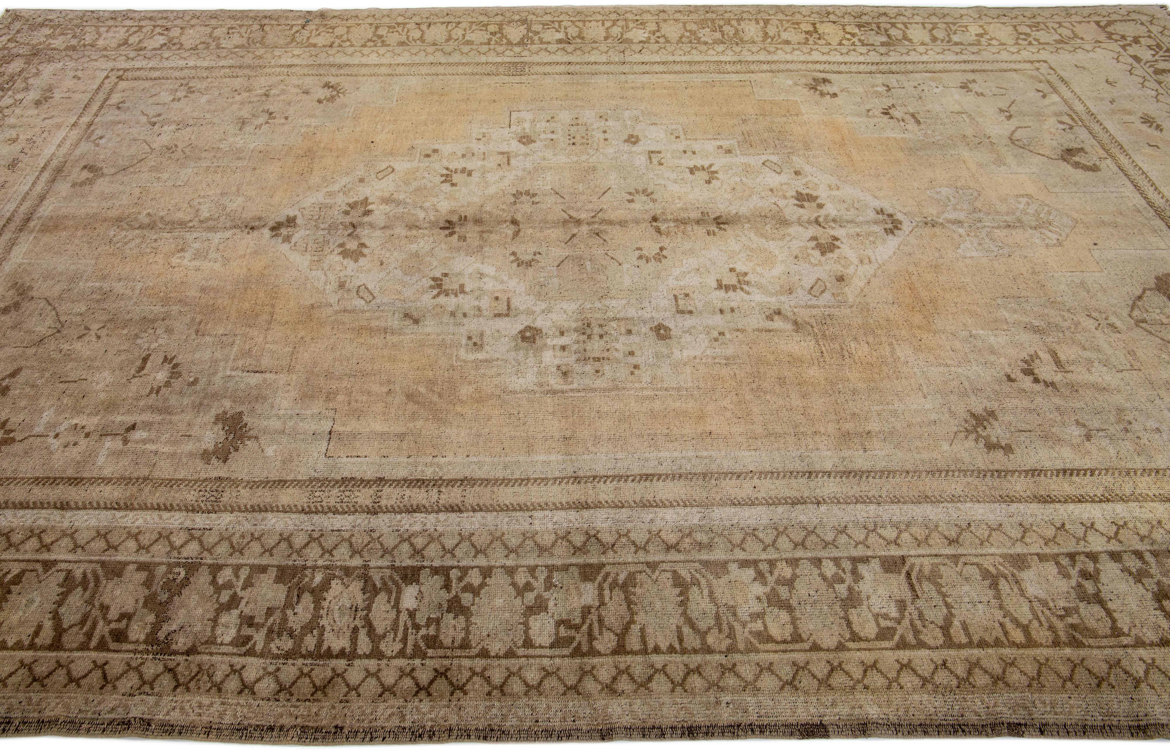 Hand-Knotted Brown Antique Khotan Handmade Wool Rug with Medallion Design For Sale