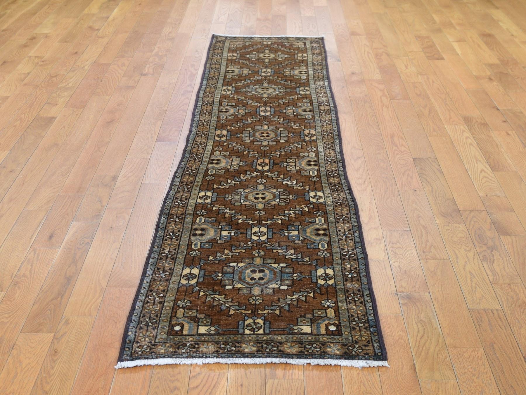 This is a truly genuine one-of-a-kind brown antique persian heriz with soft natural colors narrow runner rug. It has been knotted for months and months in the centuries-old persian weaving craftsmanship techniques by expert artisans.

Primary