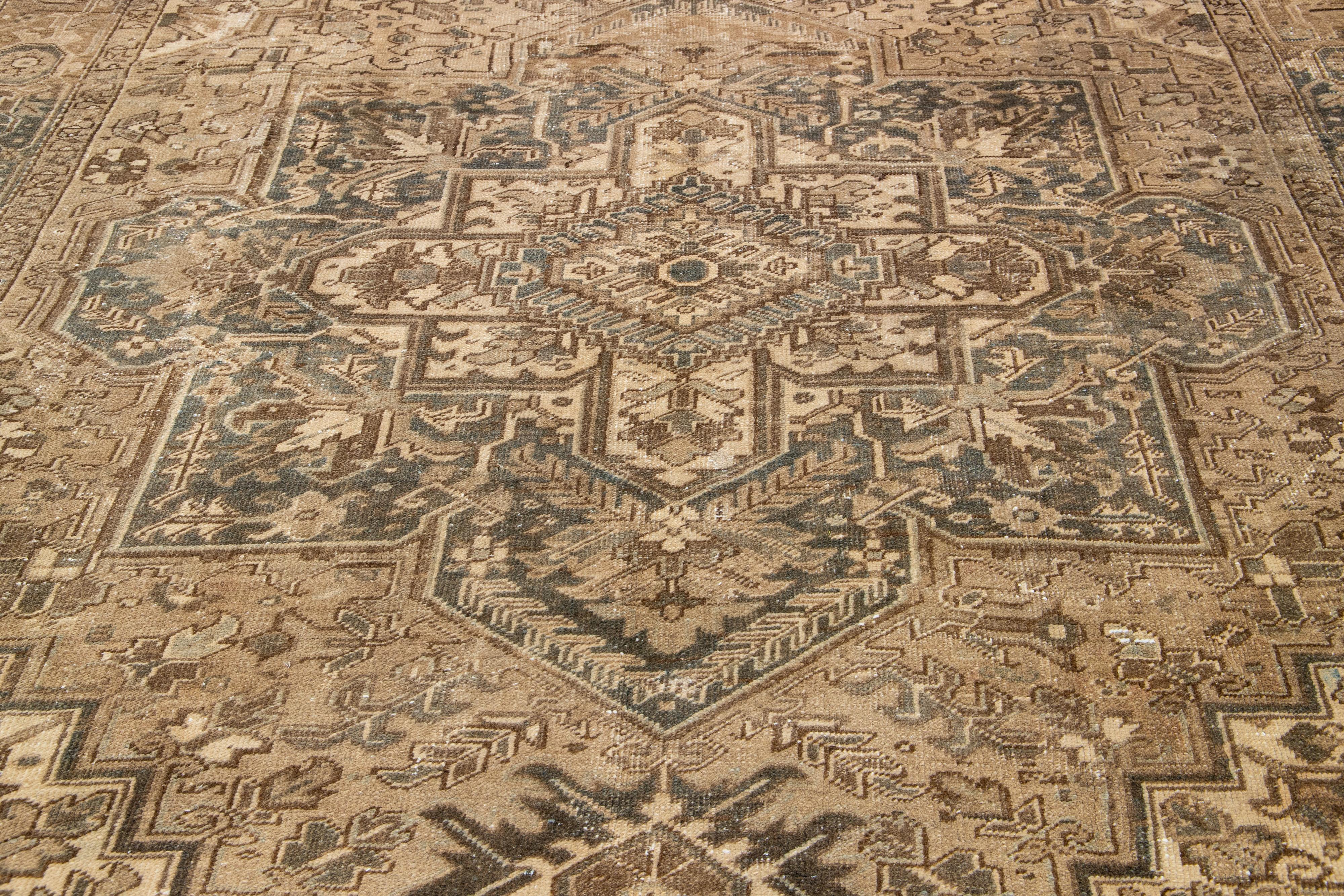 Brown Antique Persian Heriz Wool Rug Features a Medallion Motif From The 1920s  In Good Condition For Sale In Norwalk, CT