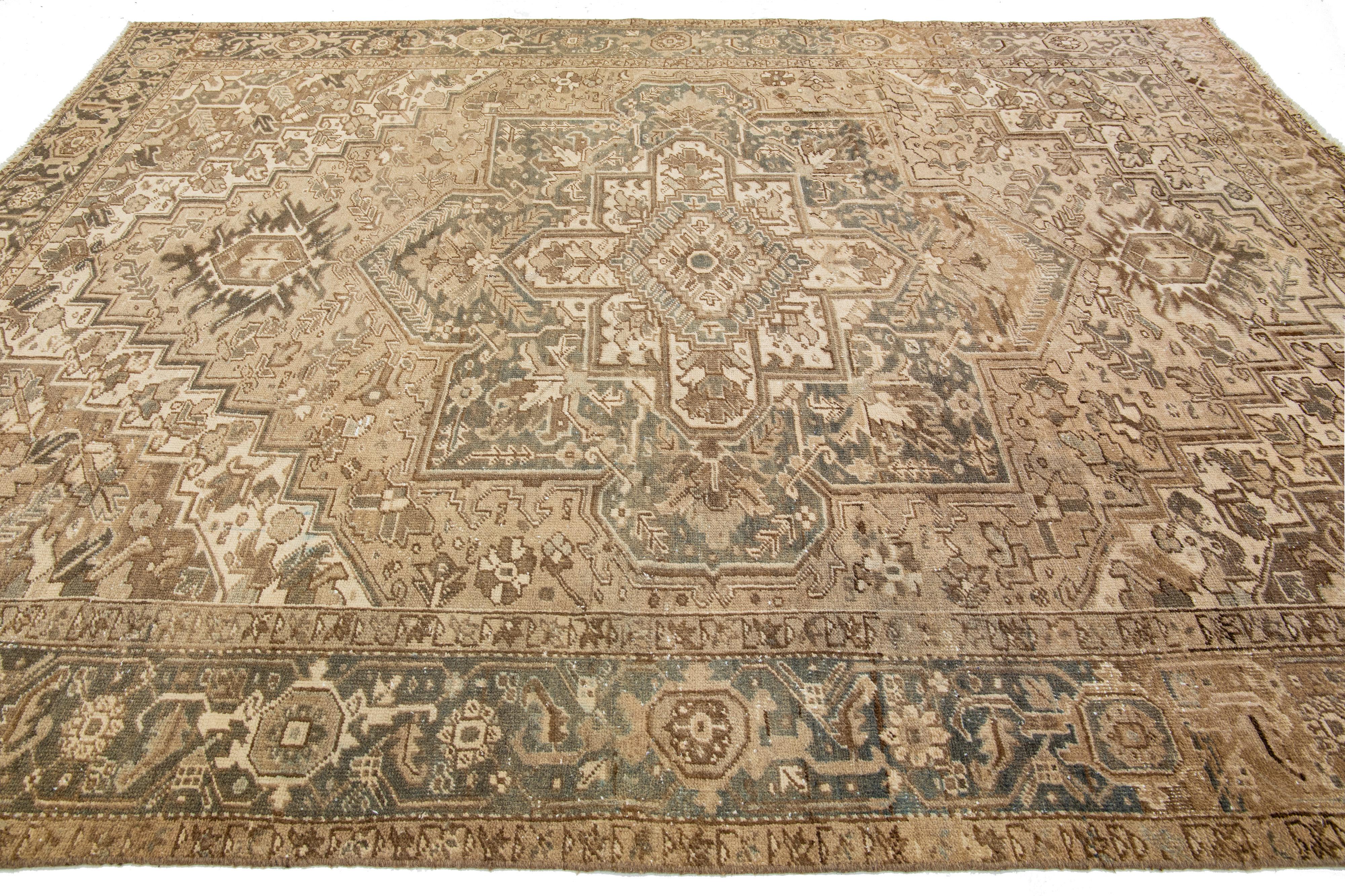 Brown Antique Persian Heriz Wool Rug Features a Medallion Motif From The 1920s  For Sale 1