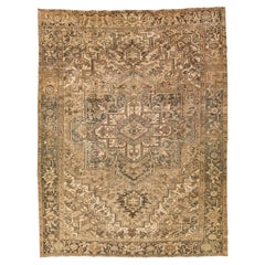 Brown Antique Persian Heriz Wool Rug Features a Medallion Motif From The 1920s 