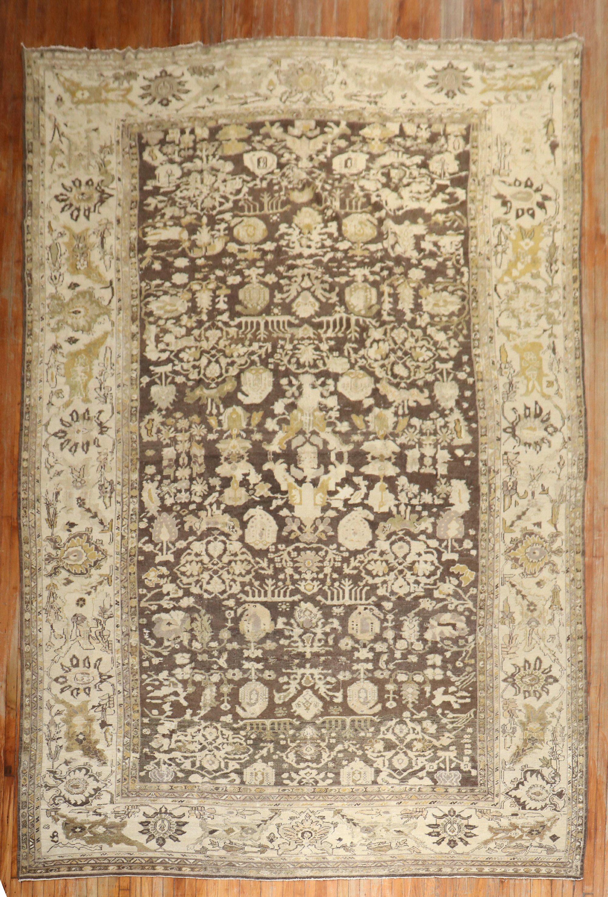 An early 20th century antique Persian Sultanabad rug in brown, ivory, and goldenrod

Measures: 10' x 16'2''.