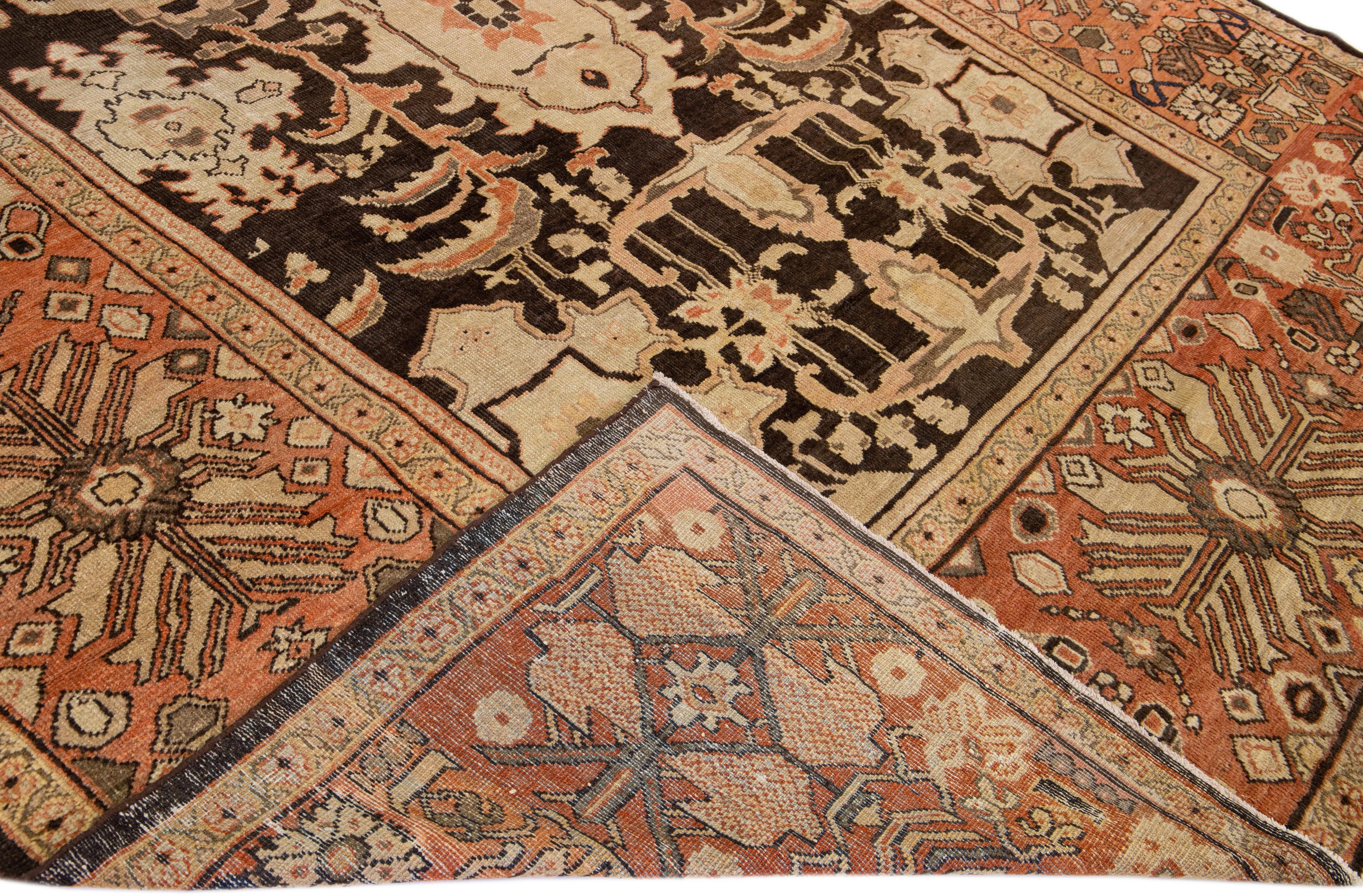 Beautiful antique Persian Sultanabad hand-knotted wool rug with a brown field. This piece has orange and tan accents in a gorgeous all-over floral pattern design.

This rug measures: 10'3