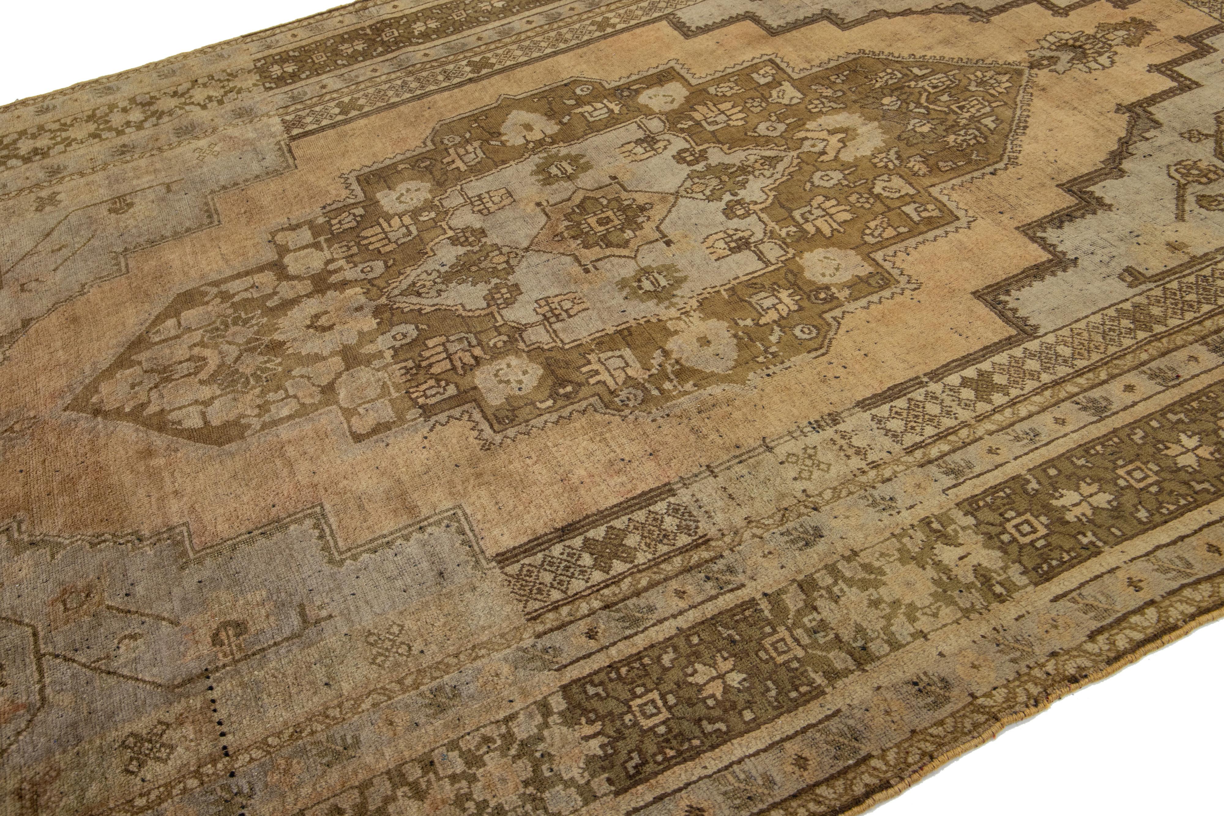 Hand-Knotted Brown Antique Turkish Khotan Wool Rug Handmade with Medallion Motif For Sale
