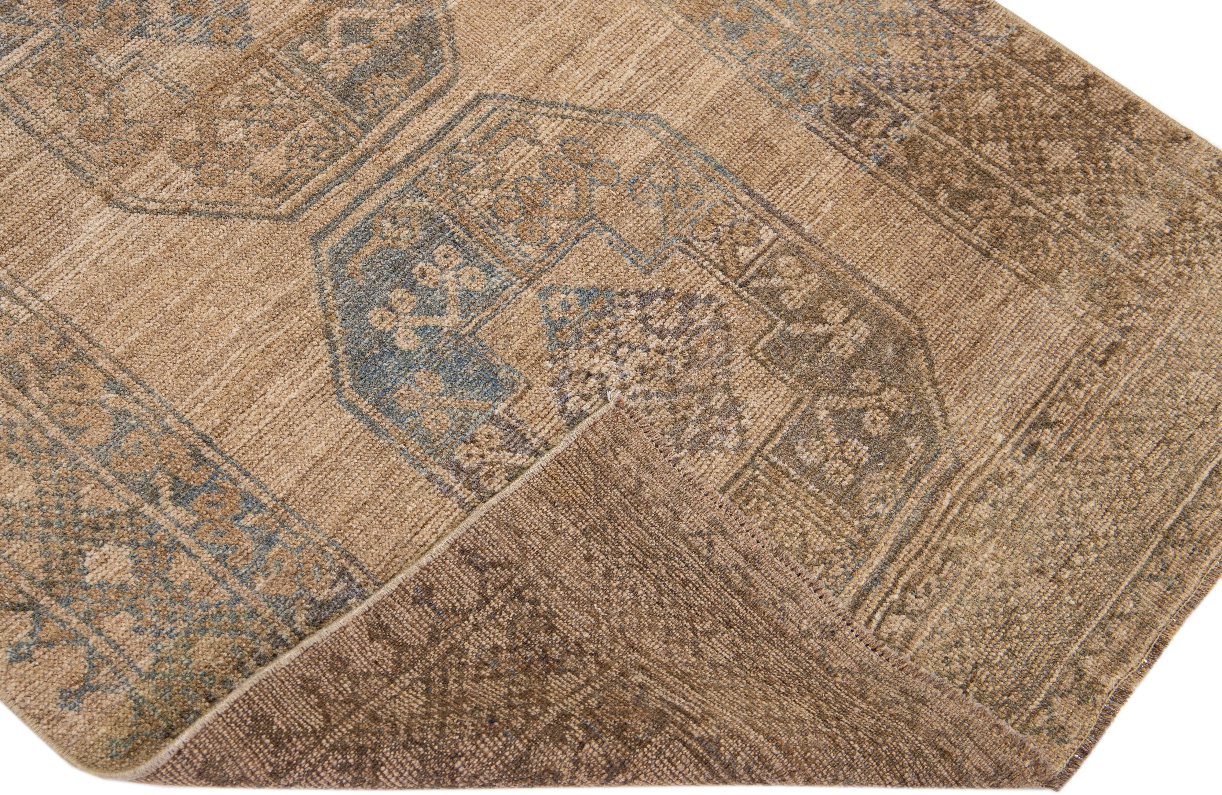 Beautiful antique Turkmen hand-knotted wool rug with a brown color field. This piece has blue accents in an all-over Gul pattern design.

This rug measures: 3'3