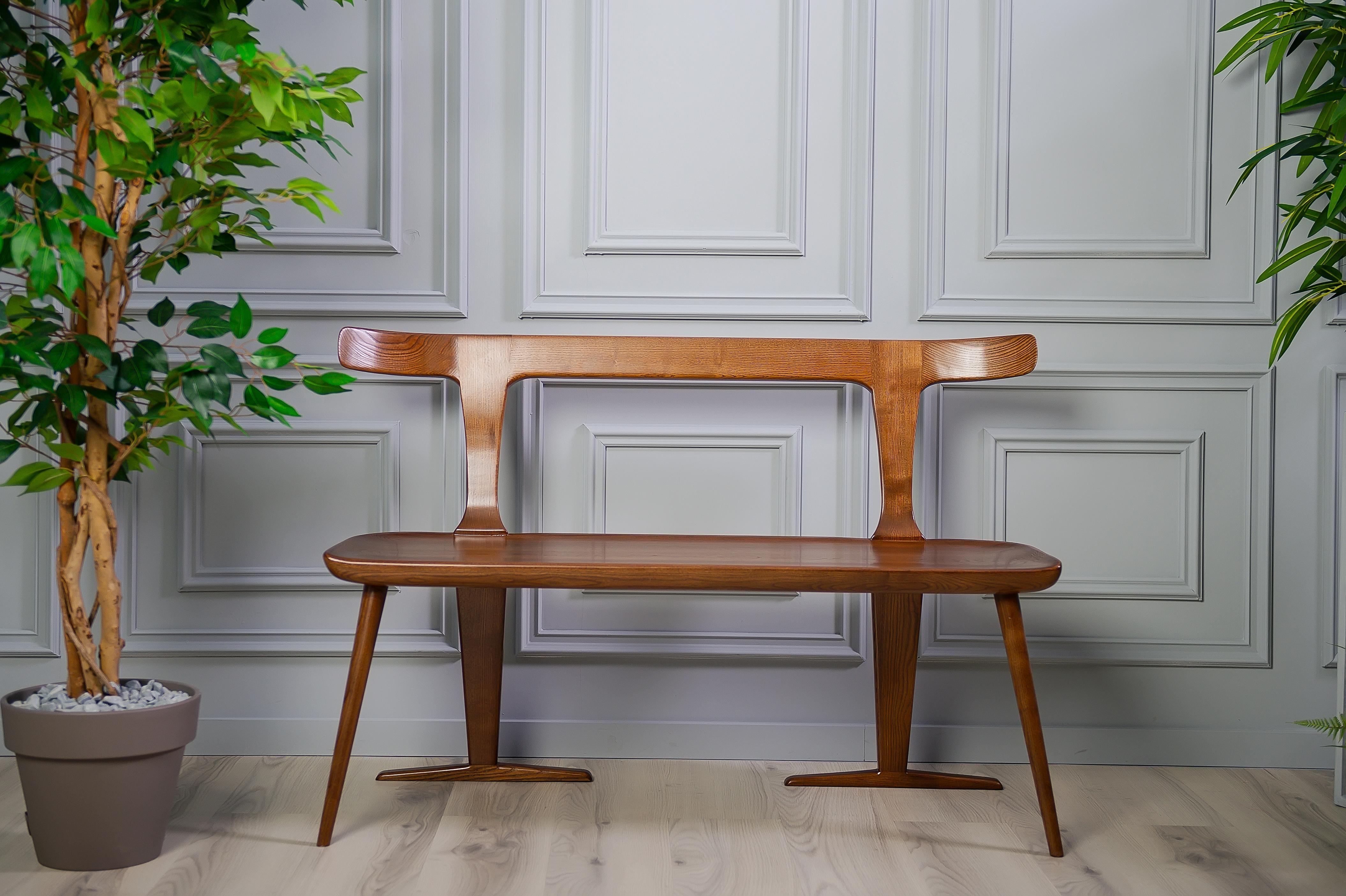 The Eola bench provides a multi-use bench that can be easily placed in the kitchen, dining room, den, lounge or other space. With a double backing and forward angled legs, this Mid-Century Modern piece offers a uniqueness that otherwise cannot be