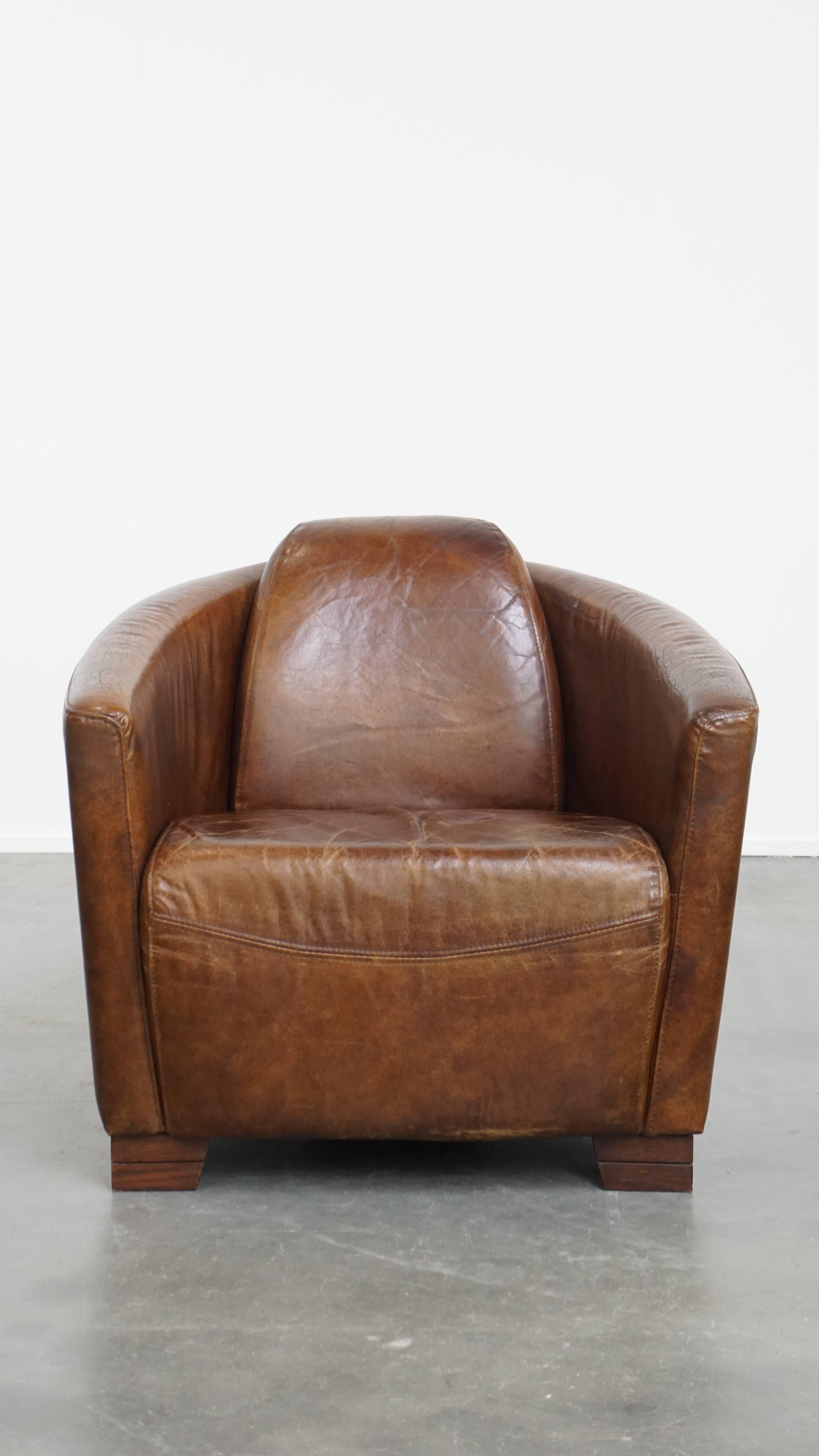 Offered here is this comfortable and unique brown Aviator design armchair crafted from cowhide leather. This timeless and striking design armchair is a true eye-catcher and fits seamlessly into almost any interior and room of your choice.

The chair
