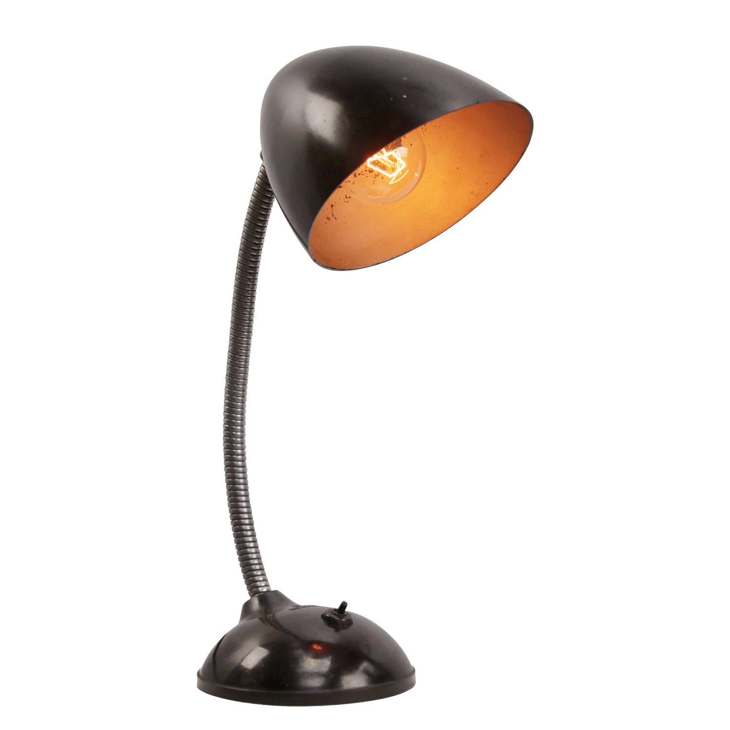 Dark brown Bakelite desk lamp
Gooseneck arm
Black cotton flex, plug and switch in base

Weight: 1.60 kg / 3.5 lb

Priced per individual item. All lamps have been made suitable by international standards for incandescent light bulbs,