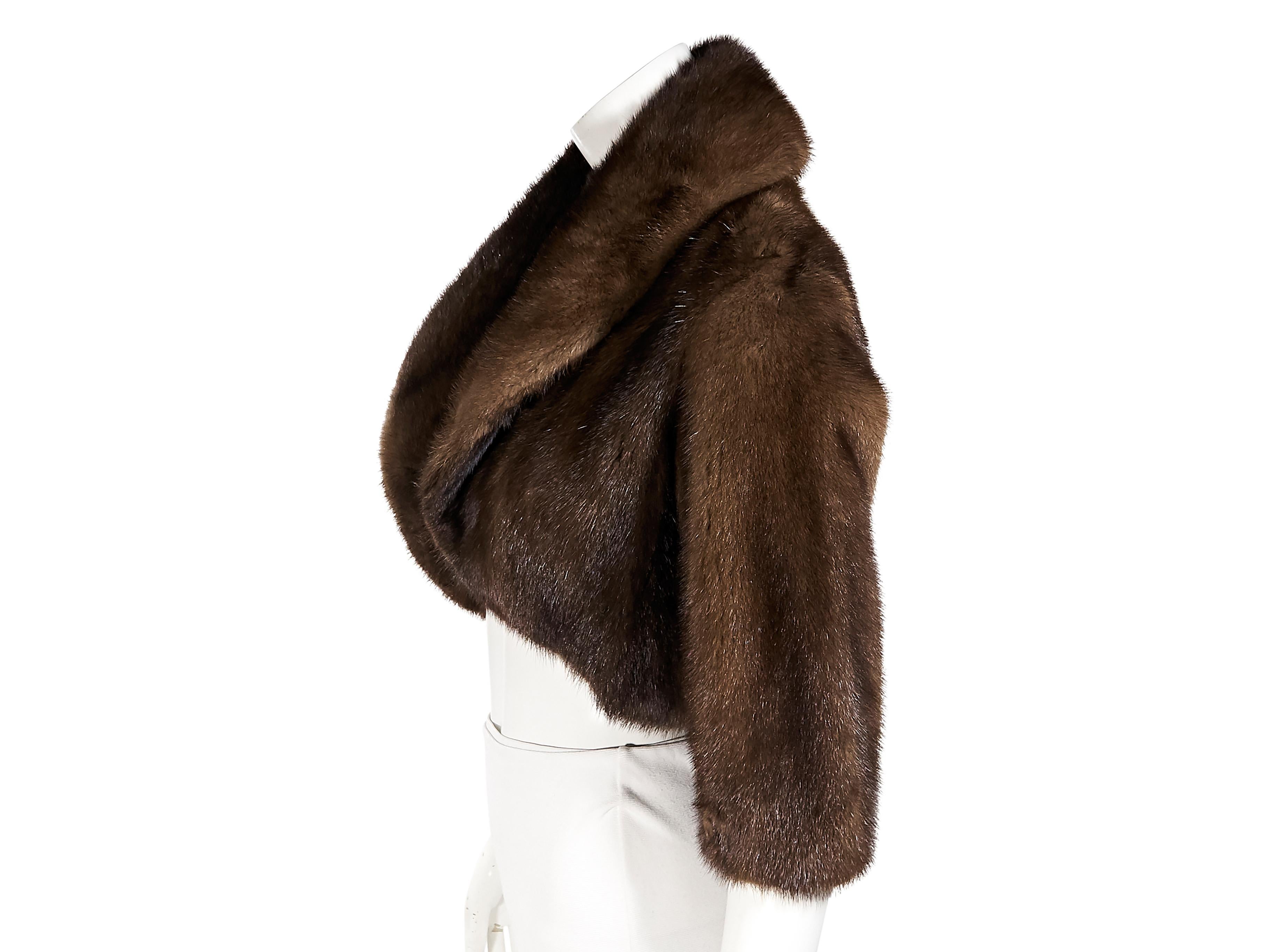 Product details:  Brown mink fur bolero jacket by Barneys New York.  Shawl collar.  Elbow-length sleeves.  Open front.  32