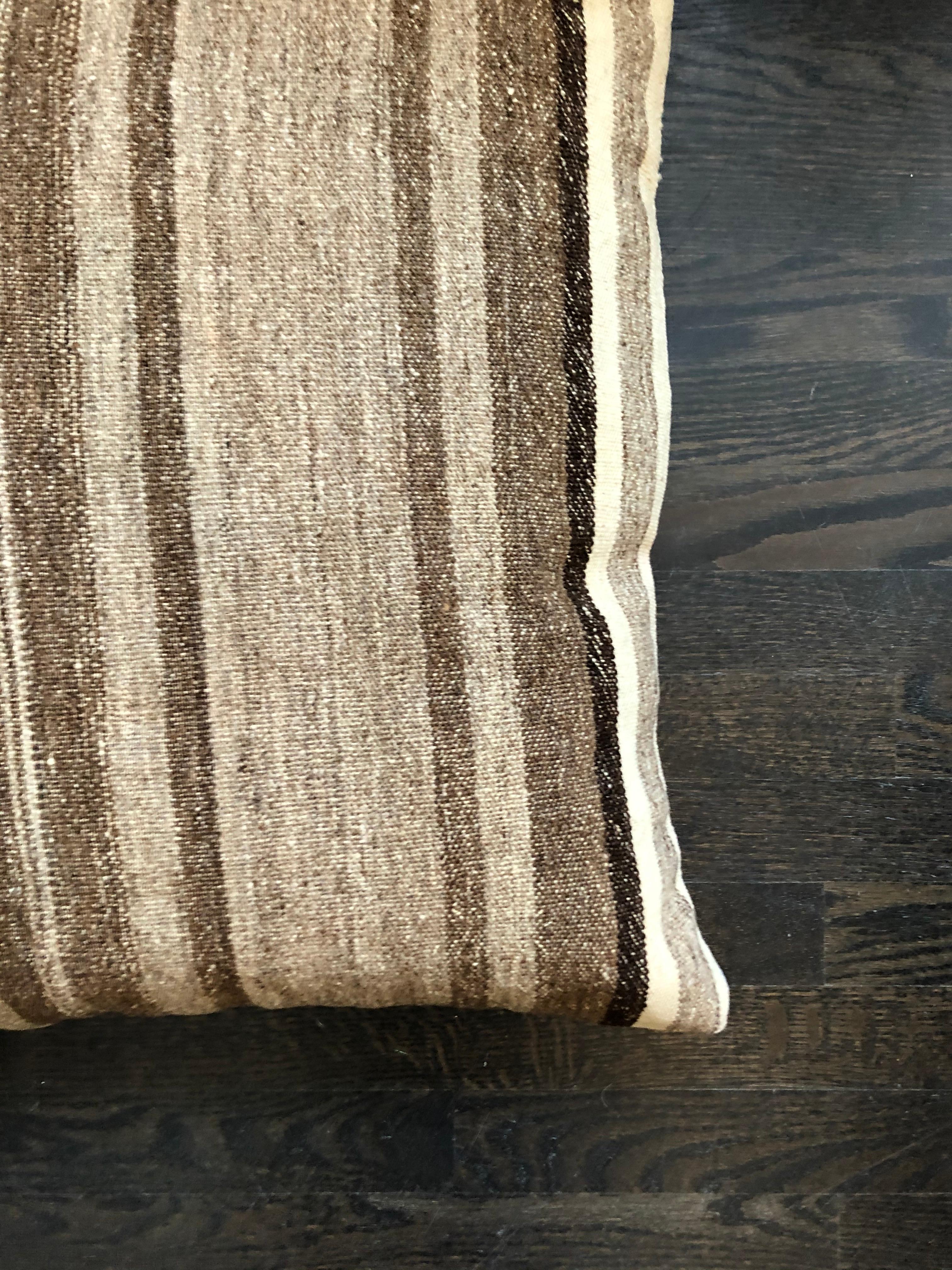 Brown and beige striped wool pillow by Le Lampade
Square striped hand knotted wool pillow. Pillow insert is feather and has a concealed zipper. 100% natural fabric, made in Italy.
     