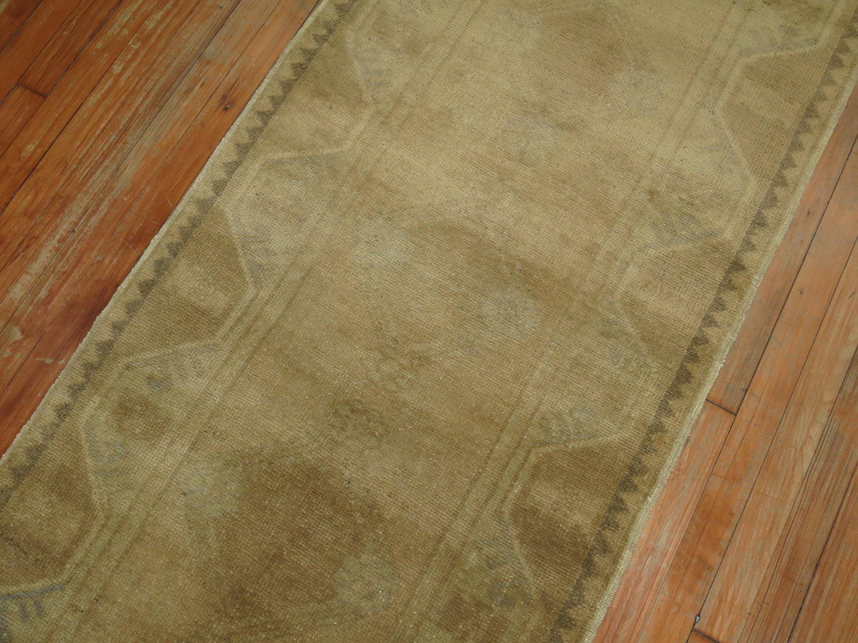 Narrow and long tone on tone Turkish Oushak runner. Small hints of green that can barely be seen,

circa mid-20th century, measures: 2'8