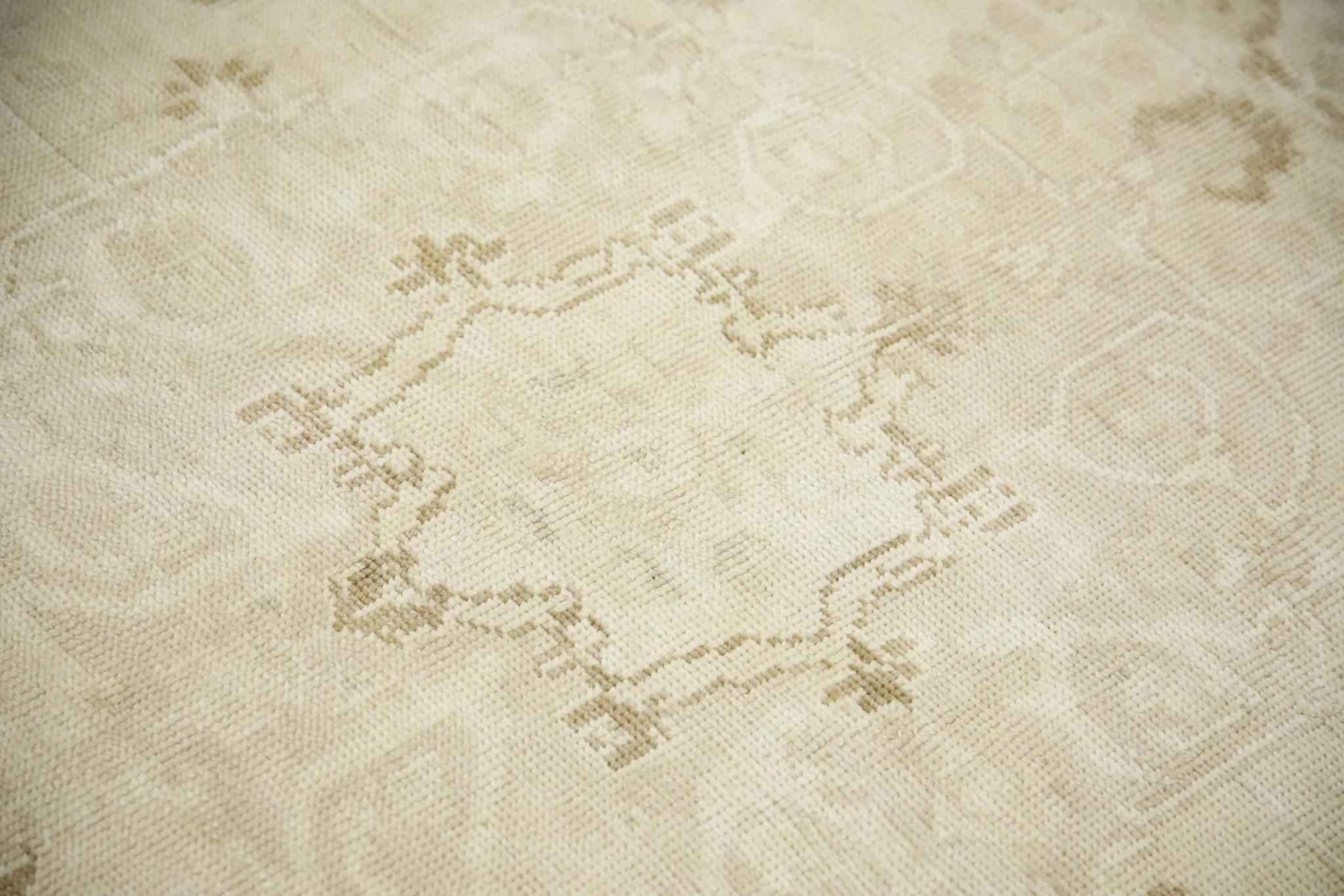 Introducing a one-of-a-kind vintage Turkish hand-knotted wool rug, carefully crafted by skilled artisans using traditional techniques passed down through generations. This exquisite rug boasts a stunning array of natural dyes, resulting in a rich