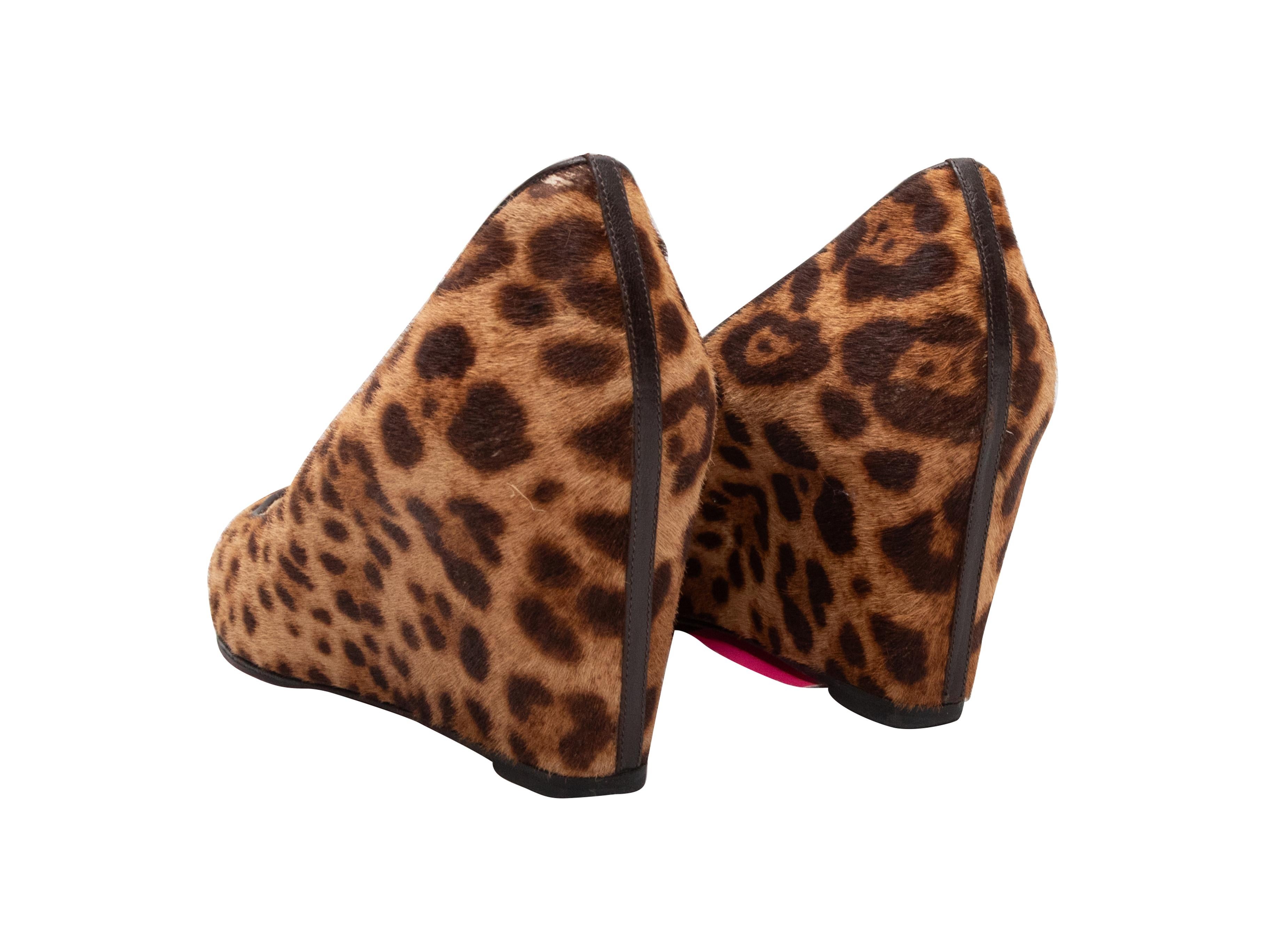  Brown and black leopard print ponyhair wedge pumps by Christian Louboutin. 3.5