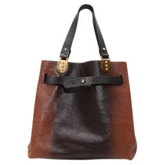 Borsa marrone e nera di Christian Louboutin foderata in cavallino Ombre