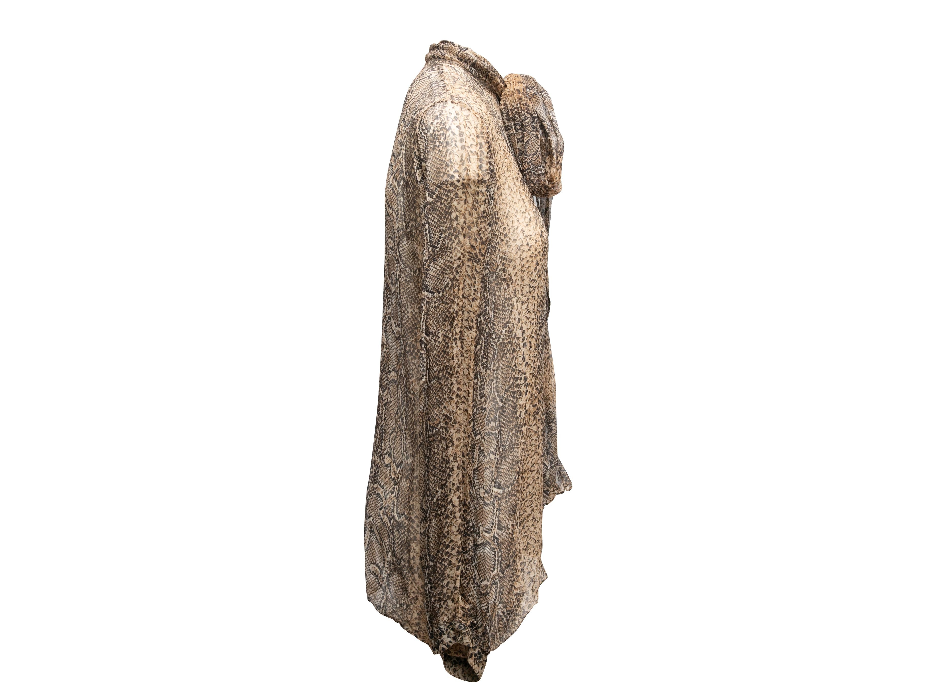 Product Details: Brown and black sheer snakeskin print pussy bow blouse by Dolce & Gabbana. Long sleeves. Front closures. 38