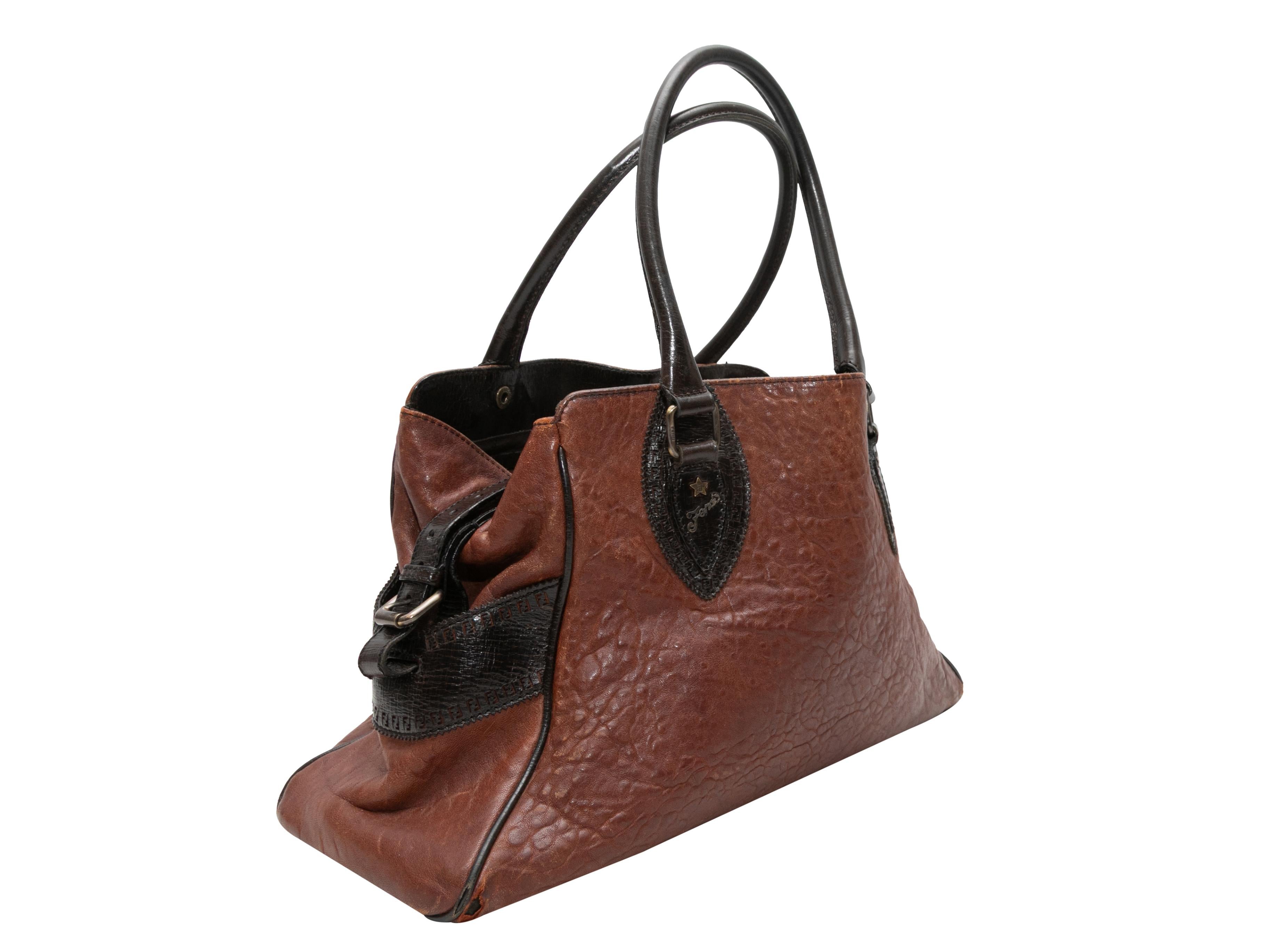 Product Details: Brown & Black Fendi Du Jour Leather Handbag. The Du Jour Handbag features a leather body, burnished hardware, dual rolled shoulder straps featuring buckle accents, and pockets with buckle accents at sides. 15