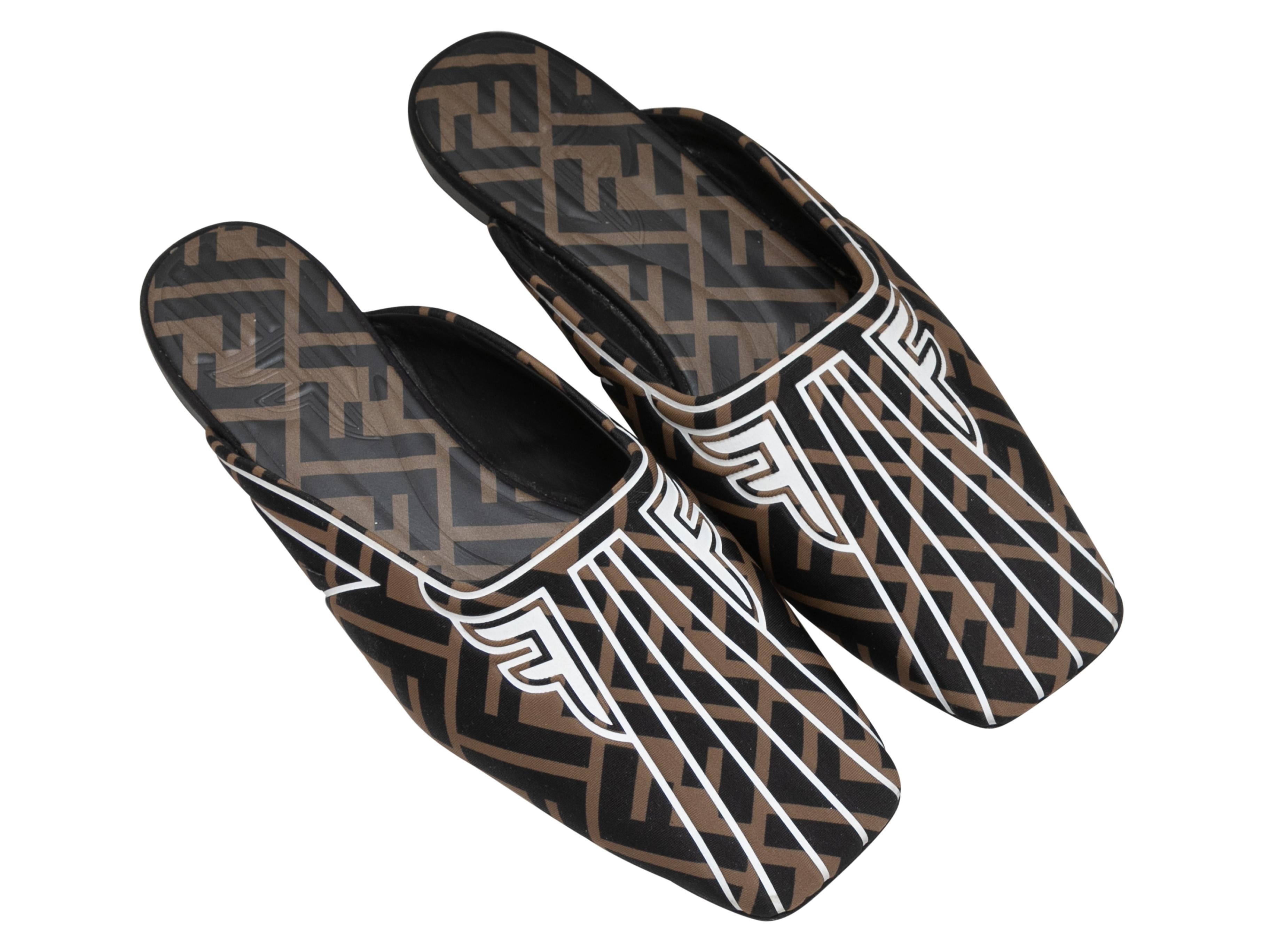 Brown and black FF printed FFreedom flat mules by Fendi. Stacked heels. 0.75