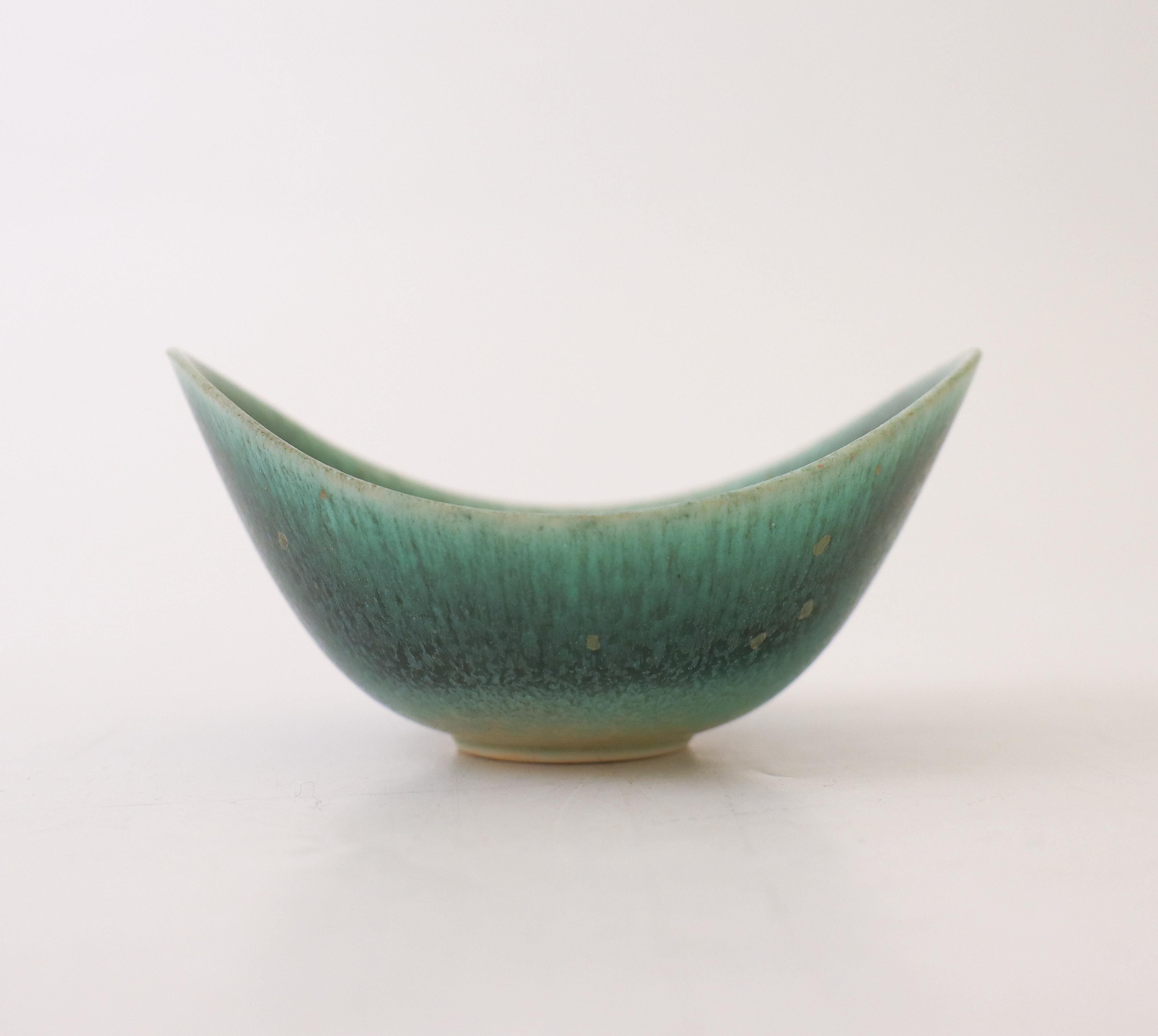 A dark turquoise or green bowl designed by Gunnar Nylund at Rörstrand, the bowl is 10.5 x 7.5 cm (4,2