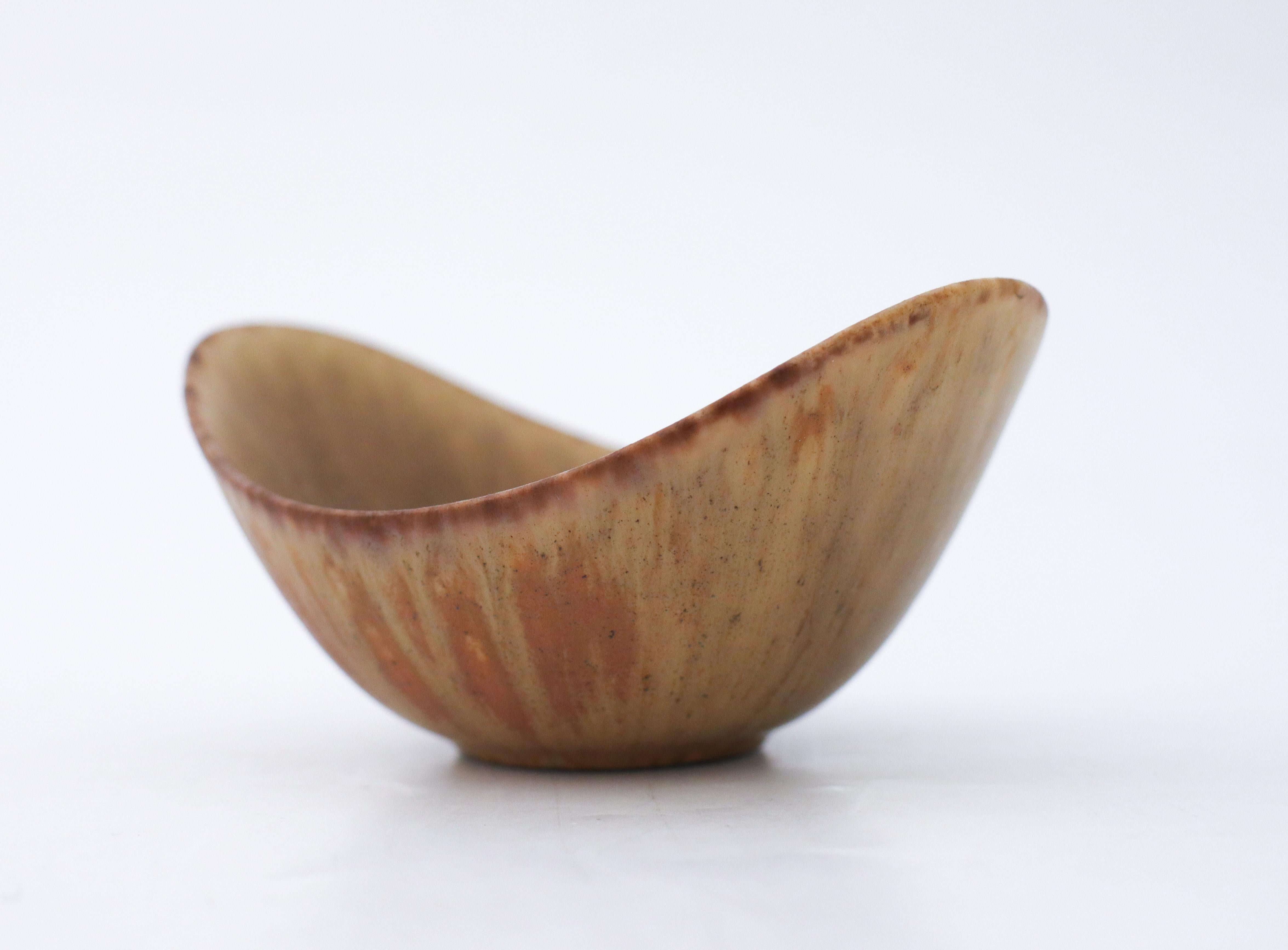 A brown bowl designed by Gunnar Nylund at Rörstrand, the bowl is 5 cm (2