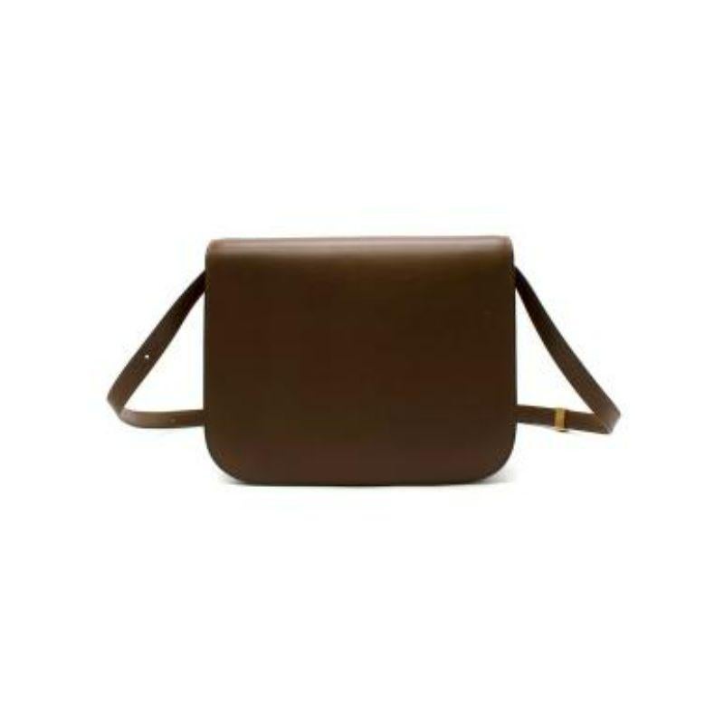 Celine Brown Box Calfskin Medium Classic Box Bag
 
 
 
 -Shoulder carry and cross-body carry
 
 -Metallic closure
 
 -Two inner compartments & one zip pocket on interior wall
 
 -Removable and adjustable leather strap 
 
 -Gold tone hardware 
 
