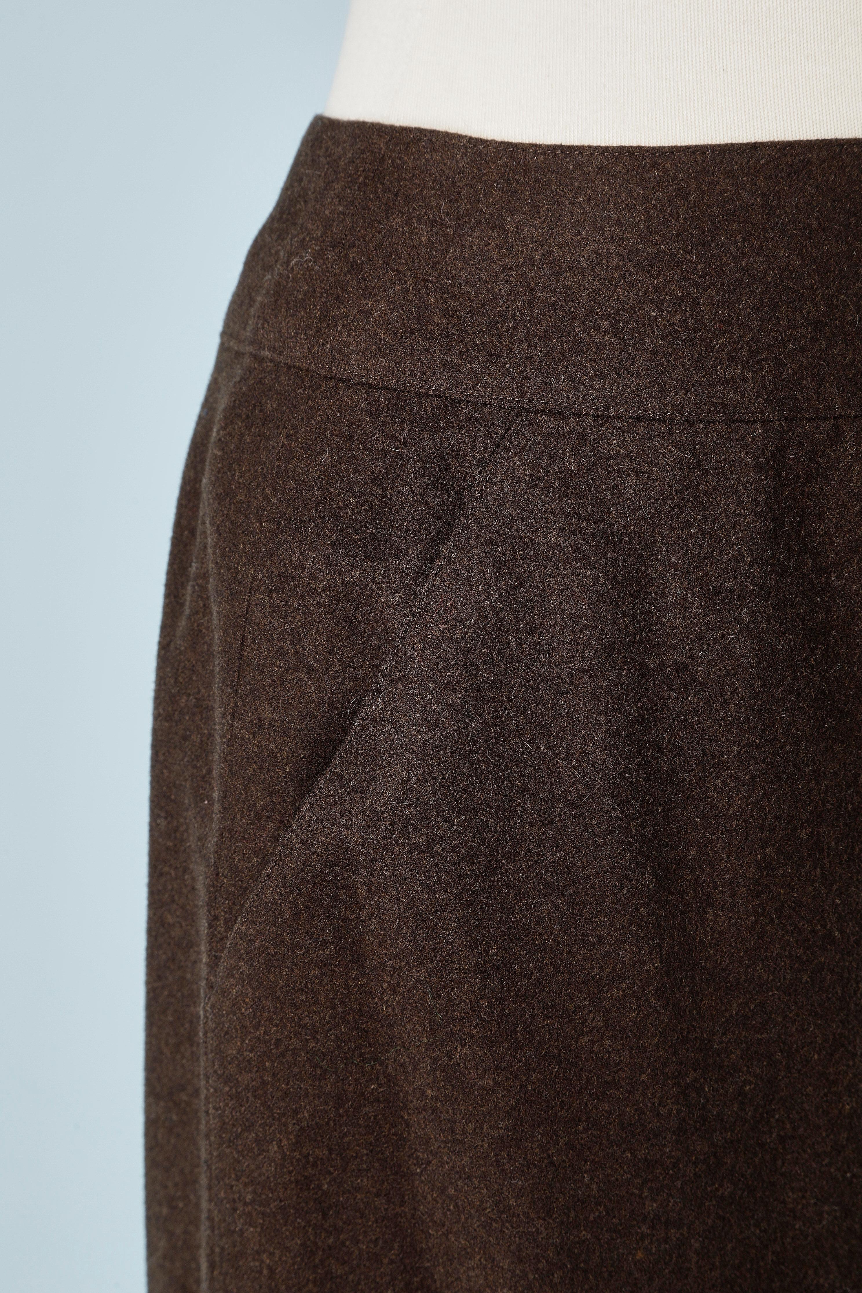 Brown cashmere skirt with pocket on the side. 
Zip in the top middle back and bottom middle back.
Branded buttons.
SIZE 38