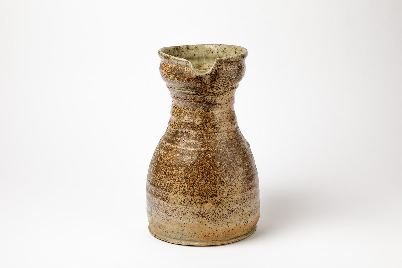 Pierre Digan

Elegant brown ceramic pitcher, stoneware pottery.

Unique handmade piece, realized, circa 1970.

Midcentury French design

Excellent original condition.

Signed under the base.

Dimension: 27 x 20 x 16cm.