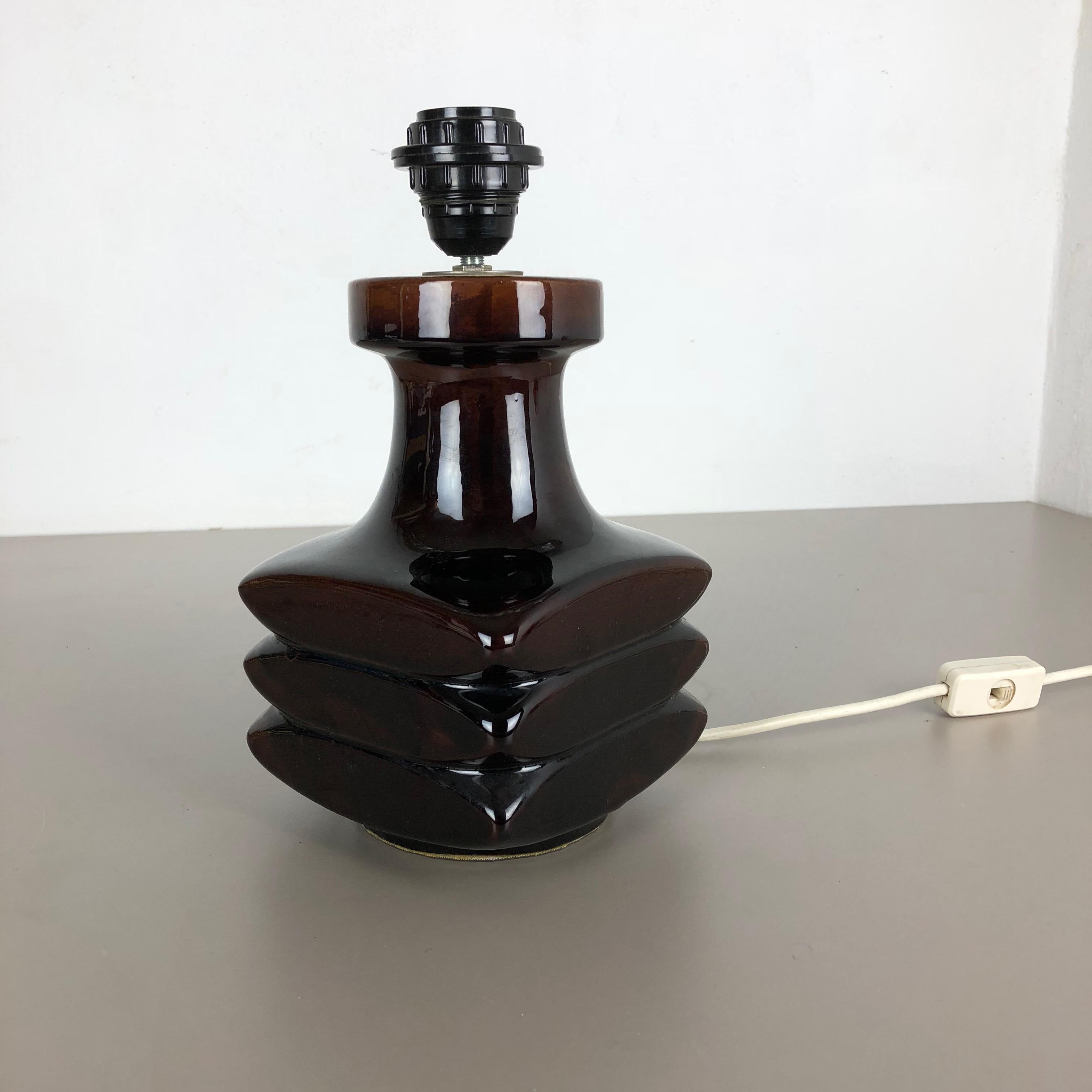 Article:

Ceramic table light


Producer:

Steuler, Germany


Designer:

Cari Zalloni




Decade:

1970s



Description:

This original vintage ceramic Pottery light base was designed in the 1970s by Cari Zalloni. This brown