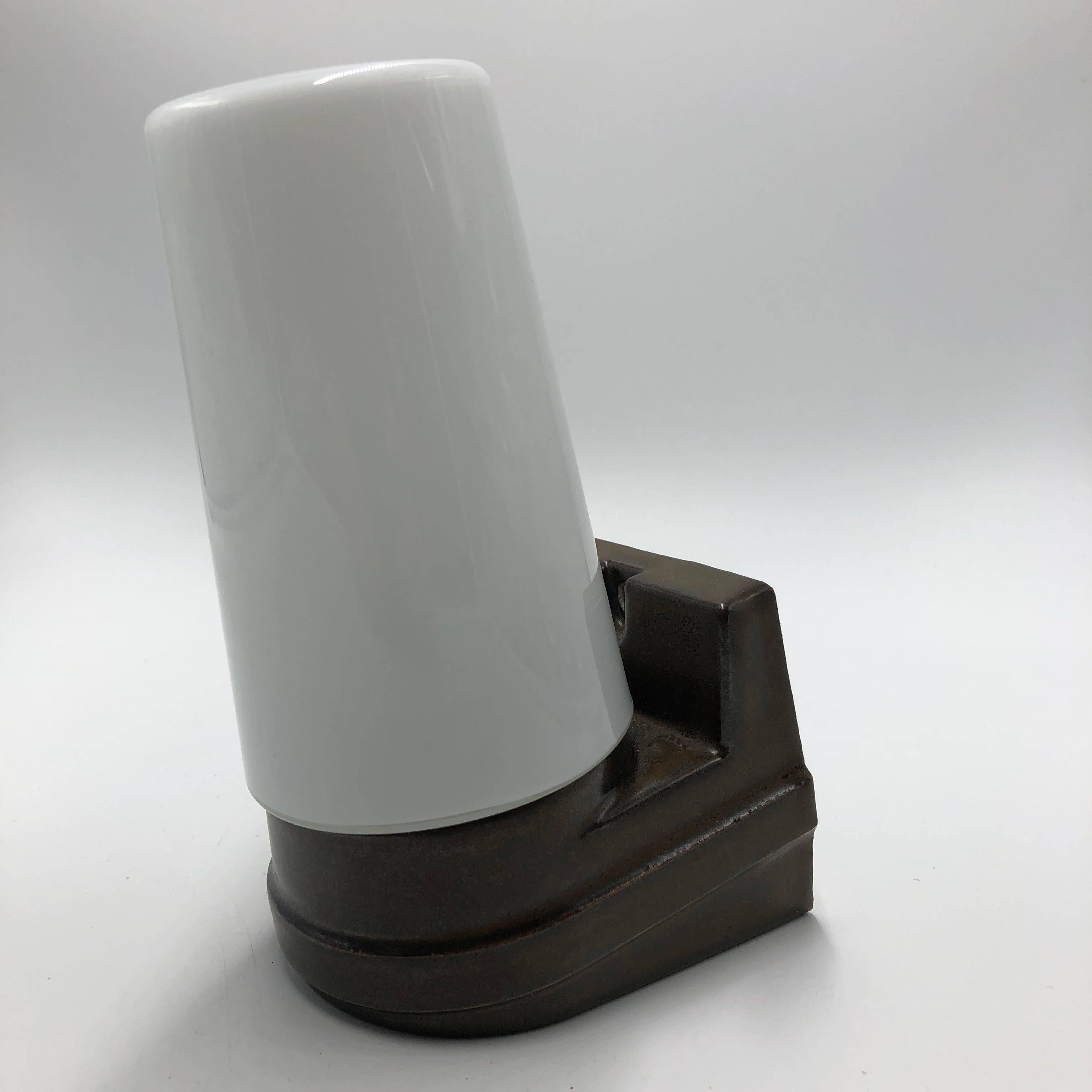 Brown ceramic with white glass bathroom lamp by Ifö, Sweden.
Designed by Sigvard Bernadotte in the 1960s.
In good working condition. No cracks, or missing pieces.
E27 lamp sockets.
 