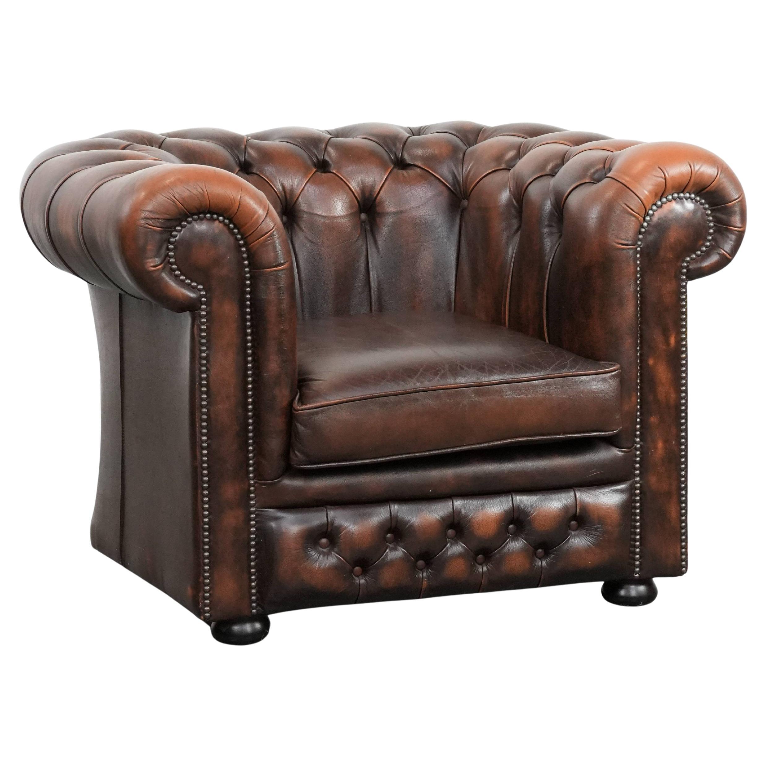 Brown Chesterfield armchair made of cowhide leather in English style