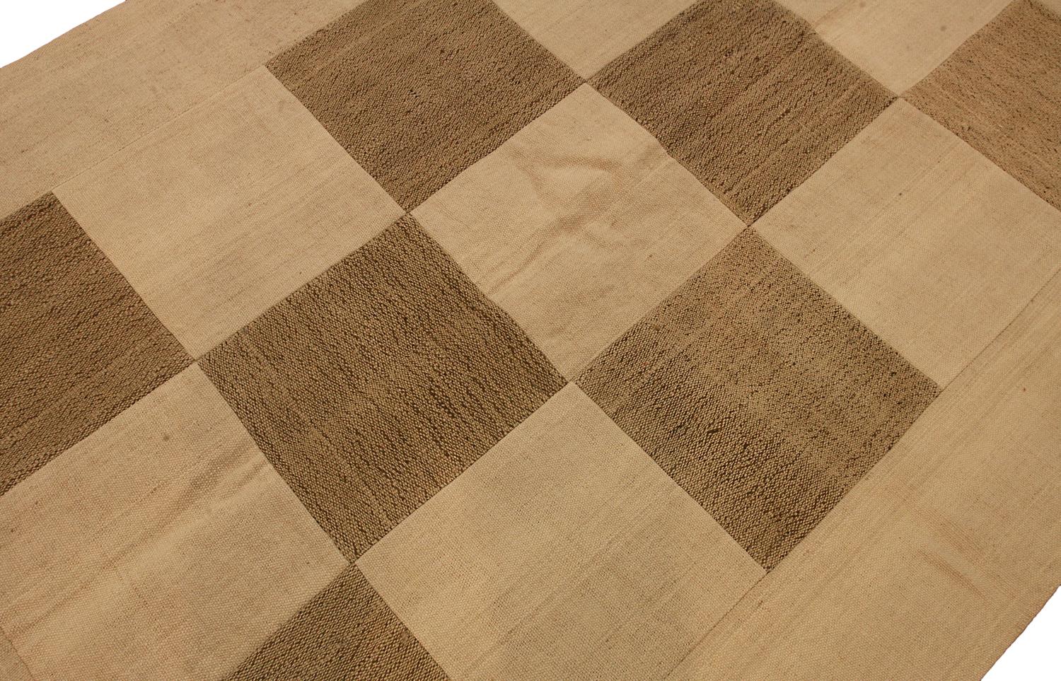 The field with open design of checkered of ivory and beige panels. This rug was made with panels sawn together in a rug suze. Full pile, backed with canvas. In general very good usable condition. Elegant and very good furnishing piece. The