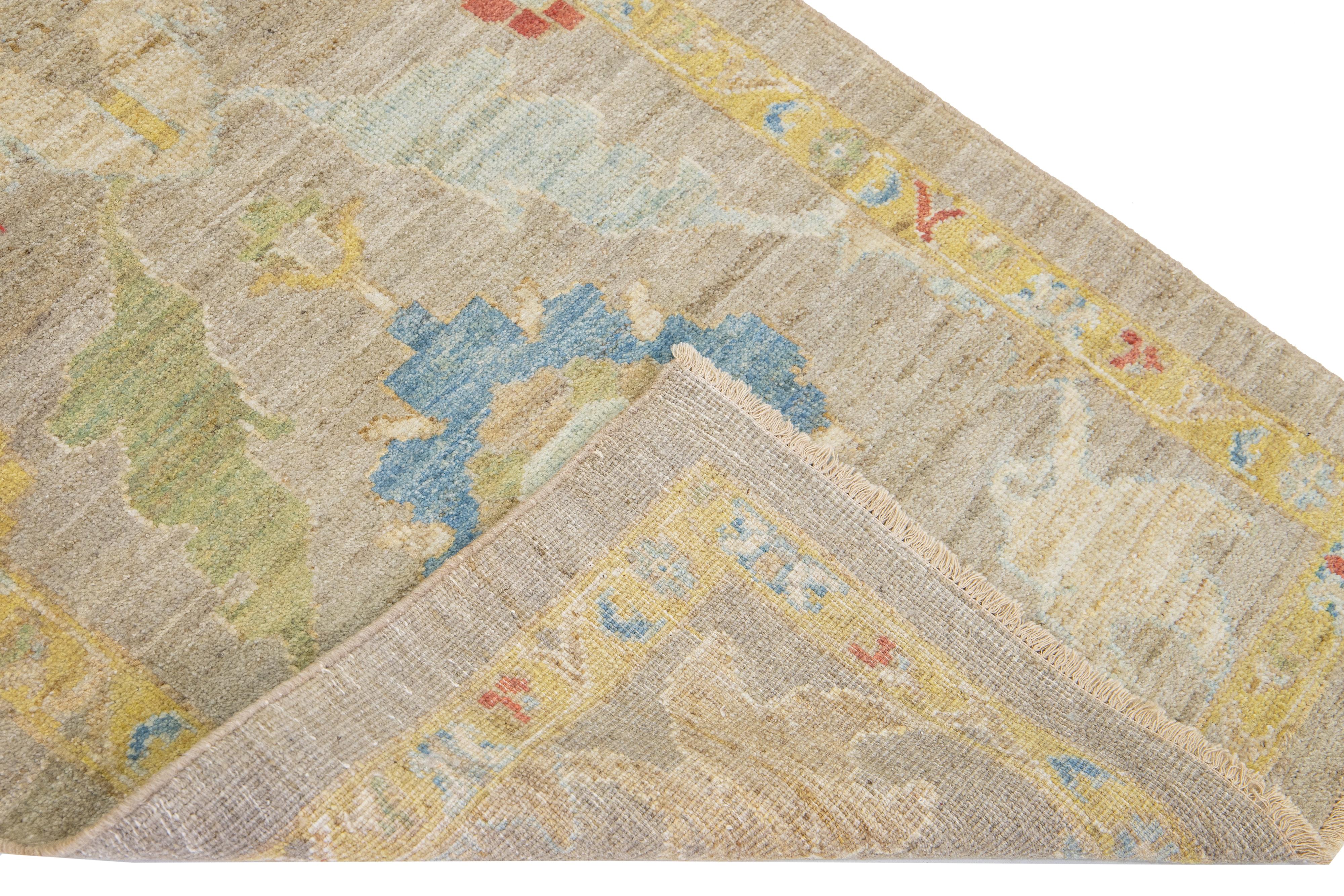 Beautiful modern Mahal hand-knotted wool runner with a brown field. This Piece has a yellow-designed frame and multicolor accent colors in a gorgeous all-over Classic floral design.

This rug measures: 2'10