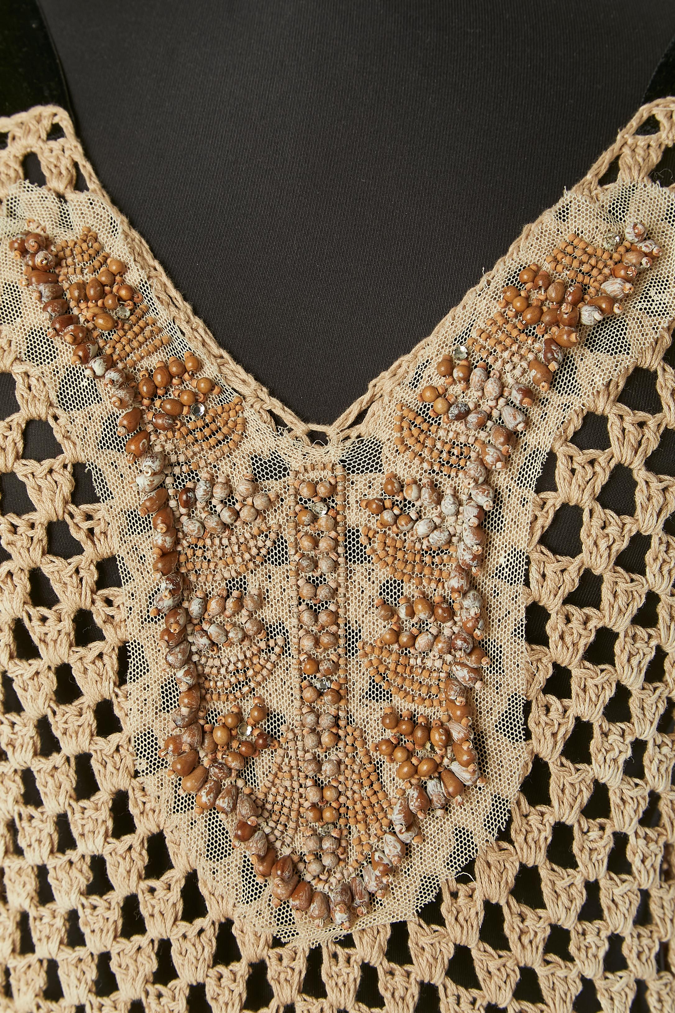 Brown see-through cotton crochet dress with beaded work ( woods beads and rhinestone) on a tulle base and velvet shoulder strap. 
SIZE 40 (It) M 