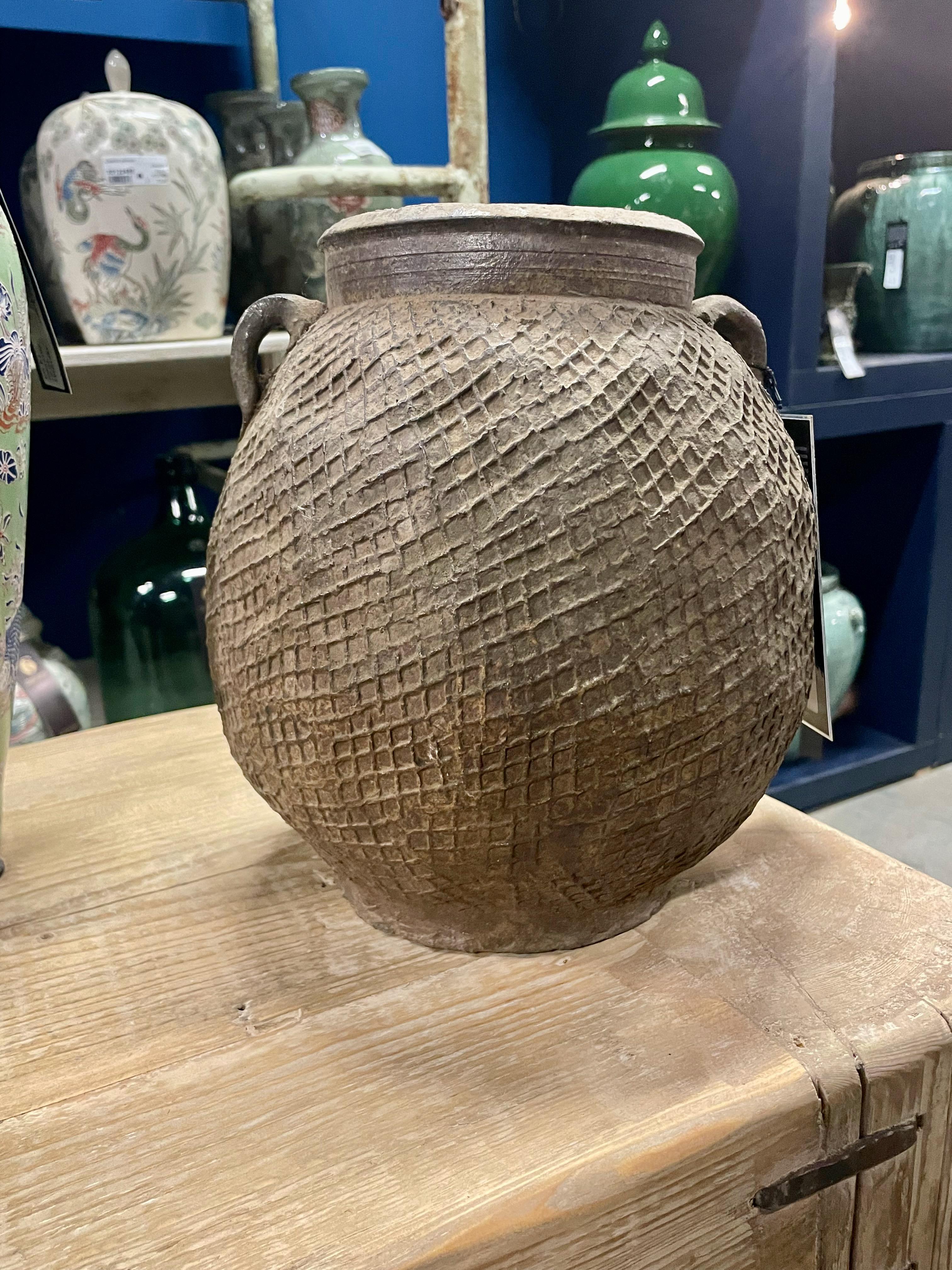 1940's Chinese stoneware vase with raised criss cross texture.
Two small handles.
Originally used to store grains.
Two available and sold individually.
ARRIVING APRIL