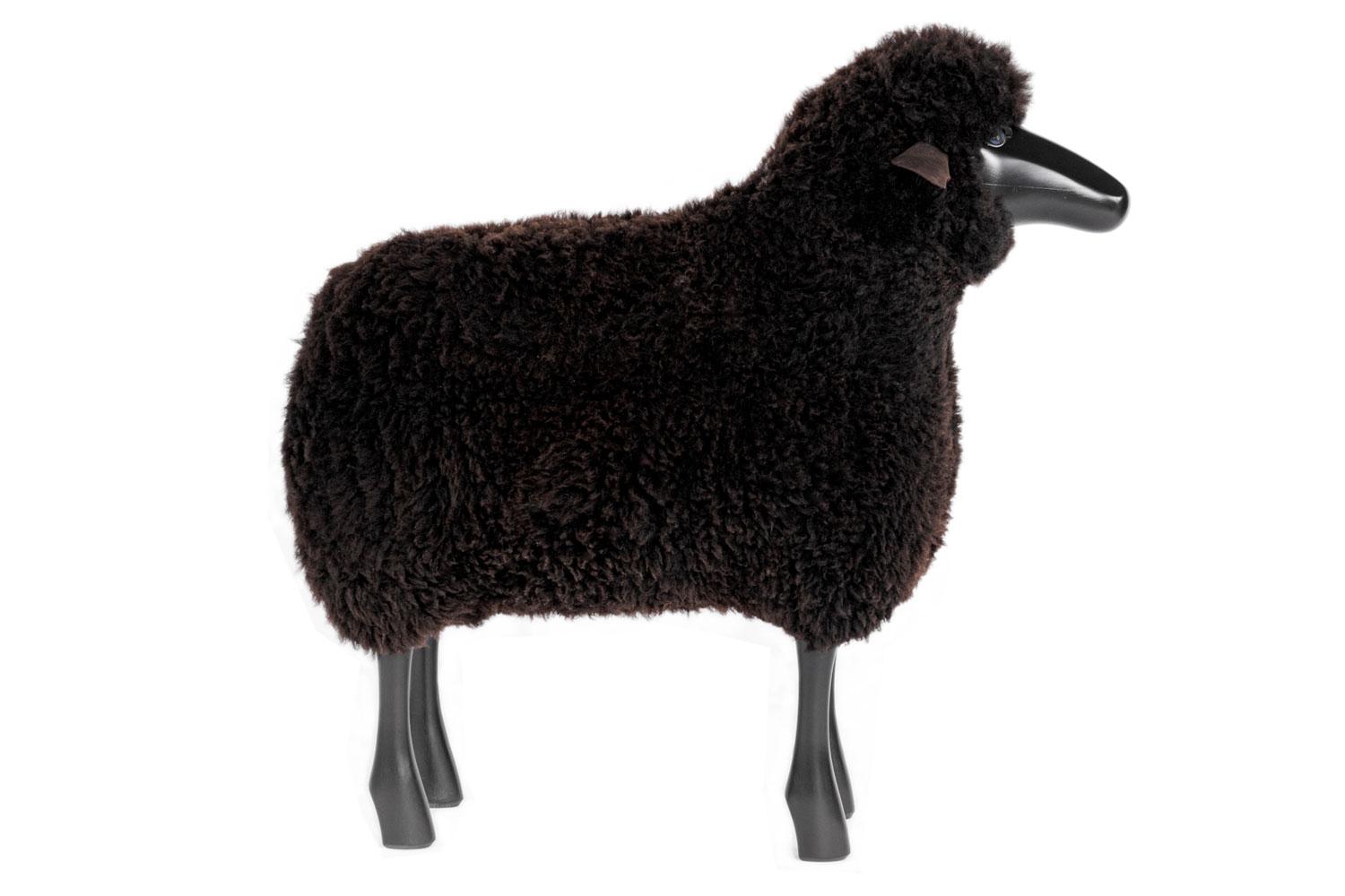 Brown wool life-size sheep

This life-sized sheep with real sheepskin on black stained beechwood and natural leather ears is suitable as original seating, ottoman or for decoration. Use as a stool for example, around a dining table the back of the