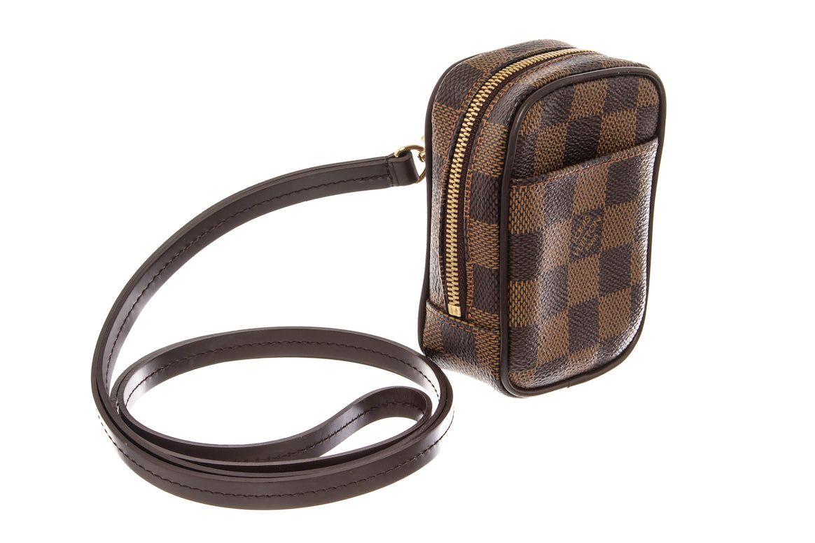 Brown Damier Ebene coated canvas Louis Vuitton Etui Okapi PM crossbody bag with gold-tone hardware, single shoulder strap, single exterior pocket, brown canvas lining & single interior pocket and a zip closure at top.

 

67536MSC