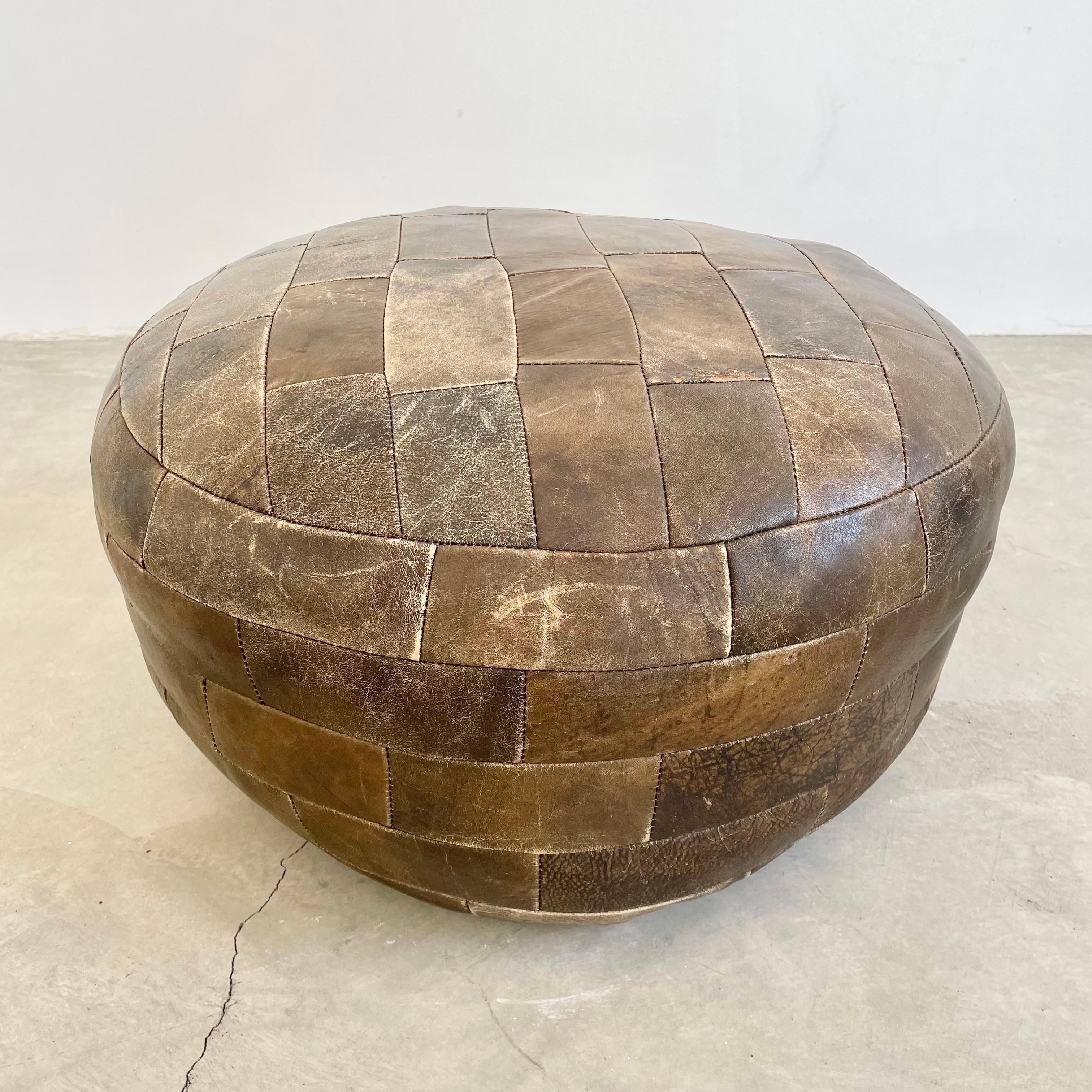 Gorgeous brown leather pouf by Swiss designer De Sede. Square patchwork design. Great vintage condition with perfect patina. Perfect accent piece.

Other poufs available in different colors and designs in separate listings.