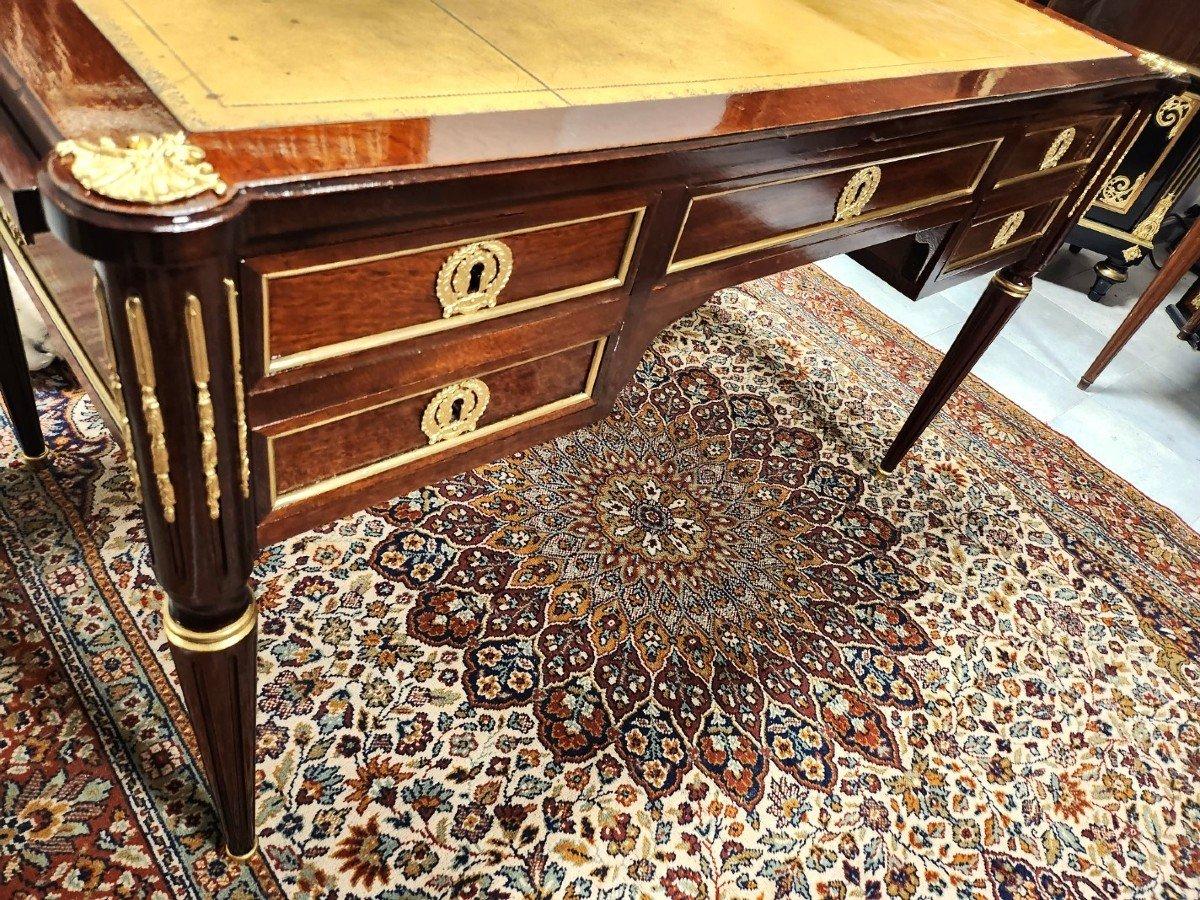 Louis XVI style Beautiful table desk,  France 19th Century Napoleon III period. 
With 2 hidden sliding extensions. Full walnut veneer. Important ornamentation of gilded bronzes with ingot molds, patterns on the sides and spandrels, keyholes, hooves,