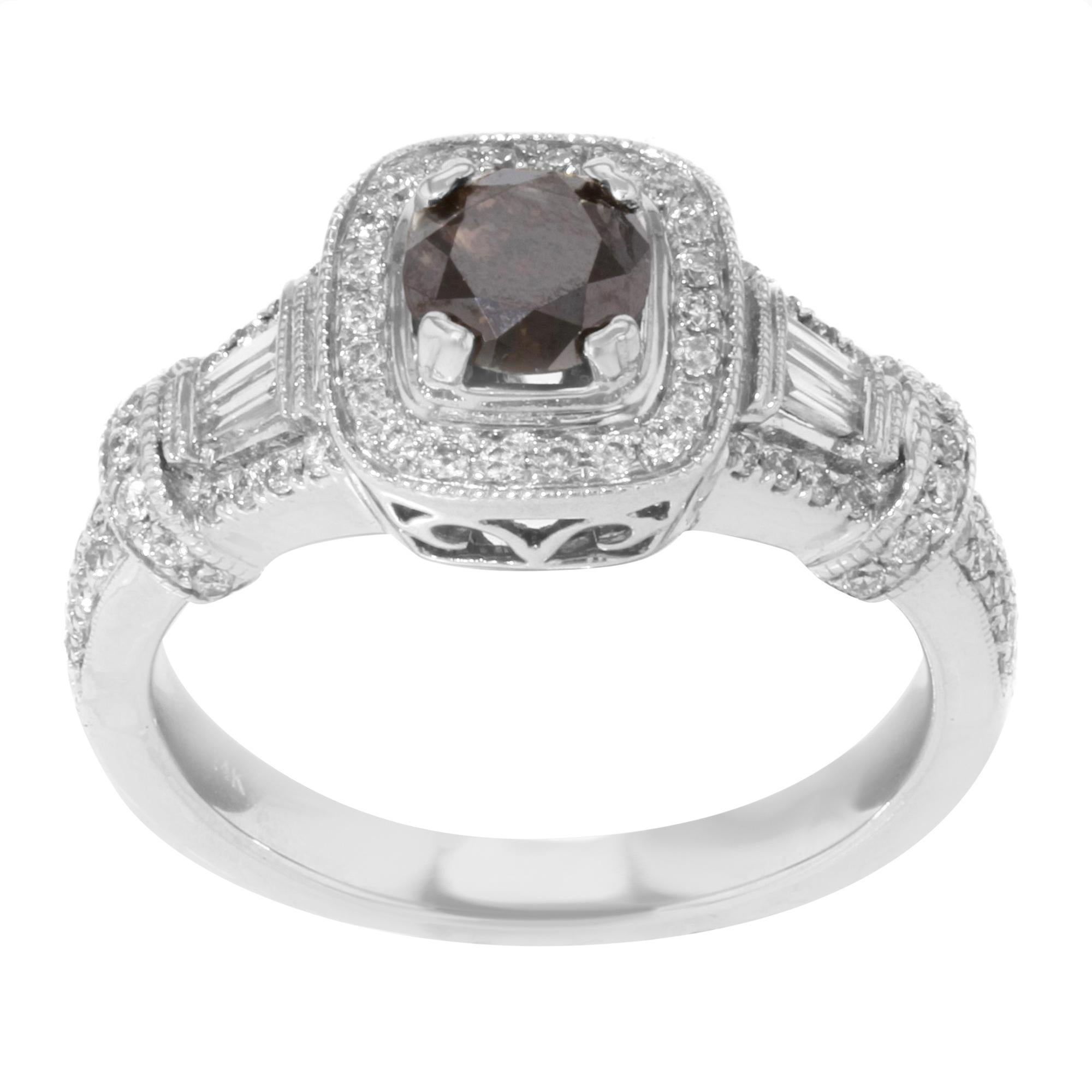 This stunning brown diamond engagement ring is crafted in 14k white gold. It features a round cut color treated brown diamond center stone weighing approx. 0.67 cttw with pave set round and baguette cut white diamond accent stones weighing approx.