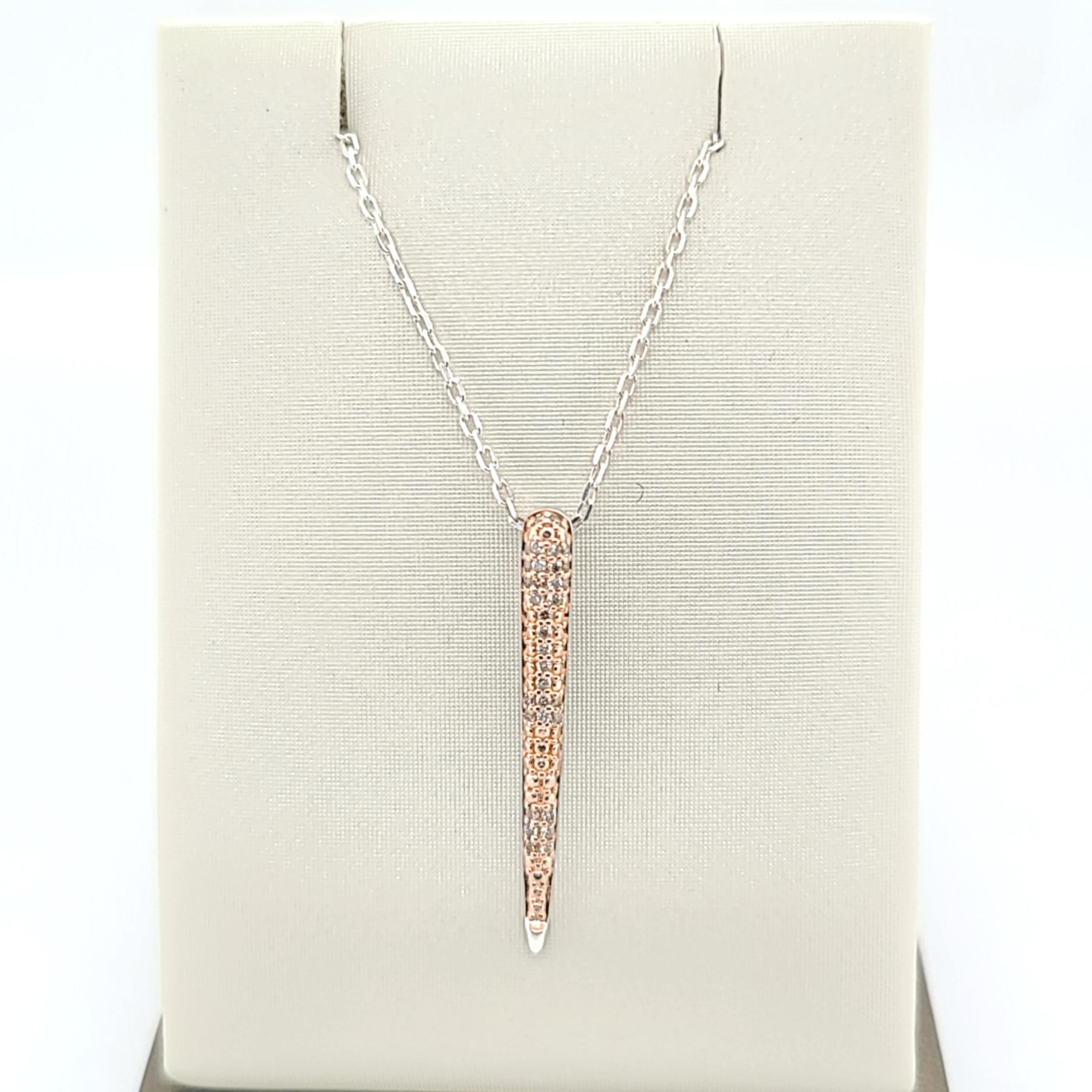 Elevate your style with this exquisite 30M01441-RG sterling silver pendant, adorned with 33 natural brown diamonds weighing a total of 0.12 carats. The pendant showcases a unique and captivating design, perfect for adding a touch of sophistication