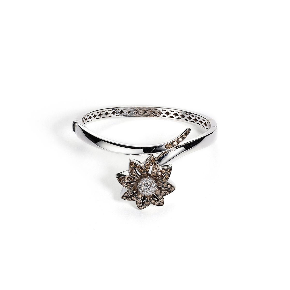 Flower bangle in 18kt white gold set with 9 diamonds 0.54 cts and 53 brown diamonds 1.47 cts